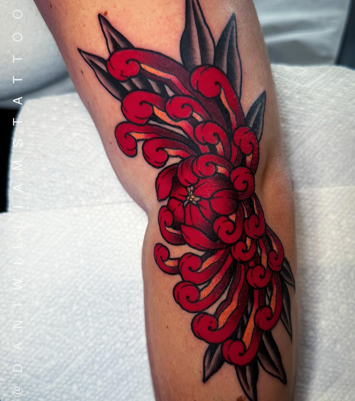 Cherry blossom American traditional tattoo on the forearm by Dani Johnson
