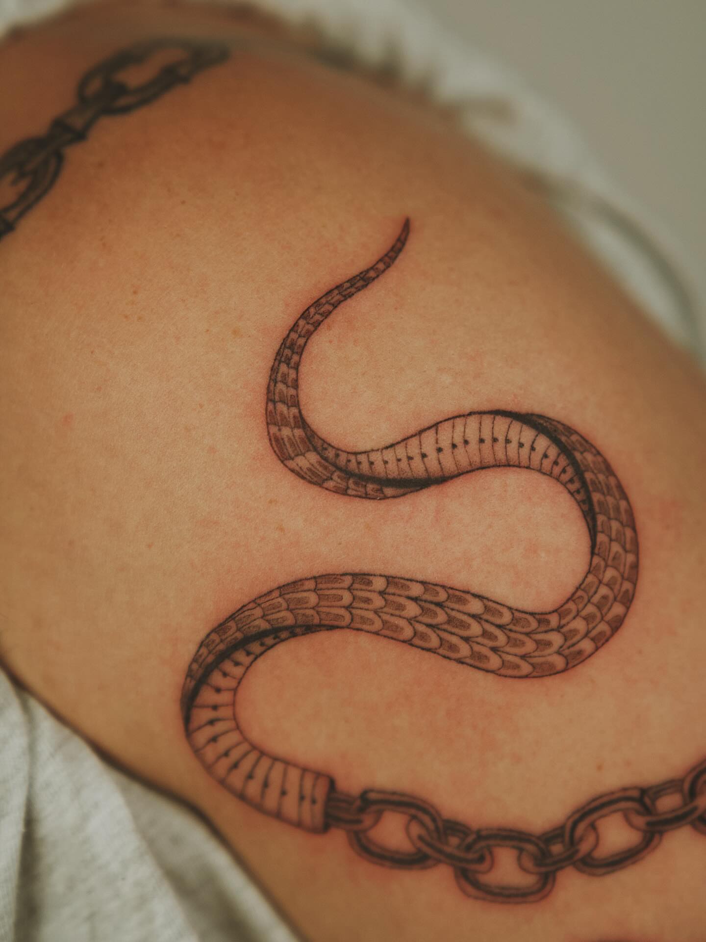 Snake black and grey tattoo on the shoulder by b i l l i e, Seattle, Washington