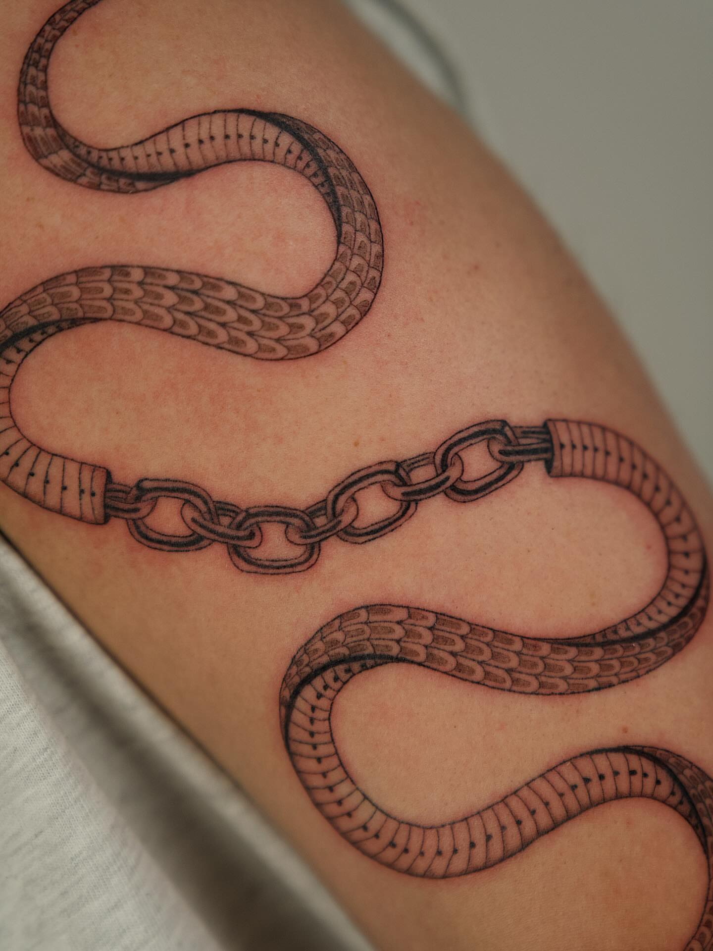 Snake black and grey tattoo on the forearm by b i l l i e, Seattle, Washington