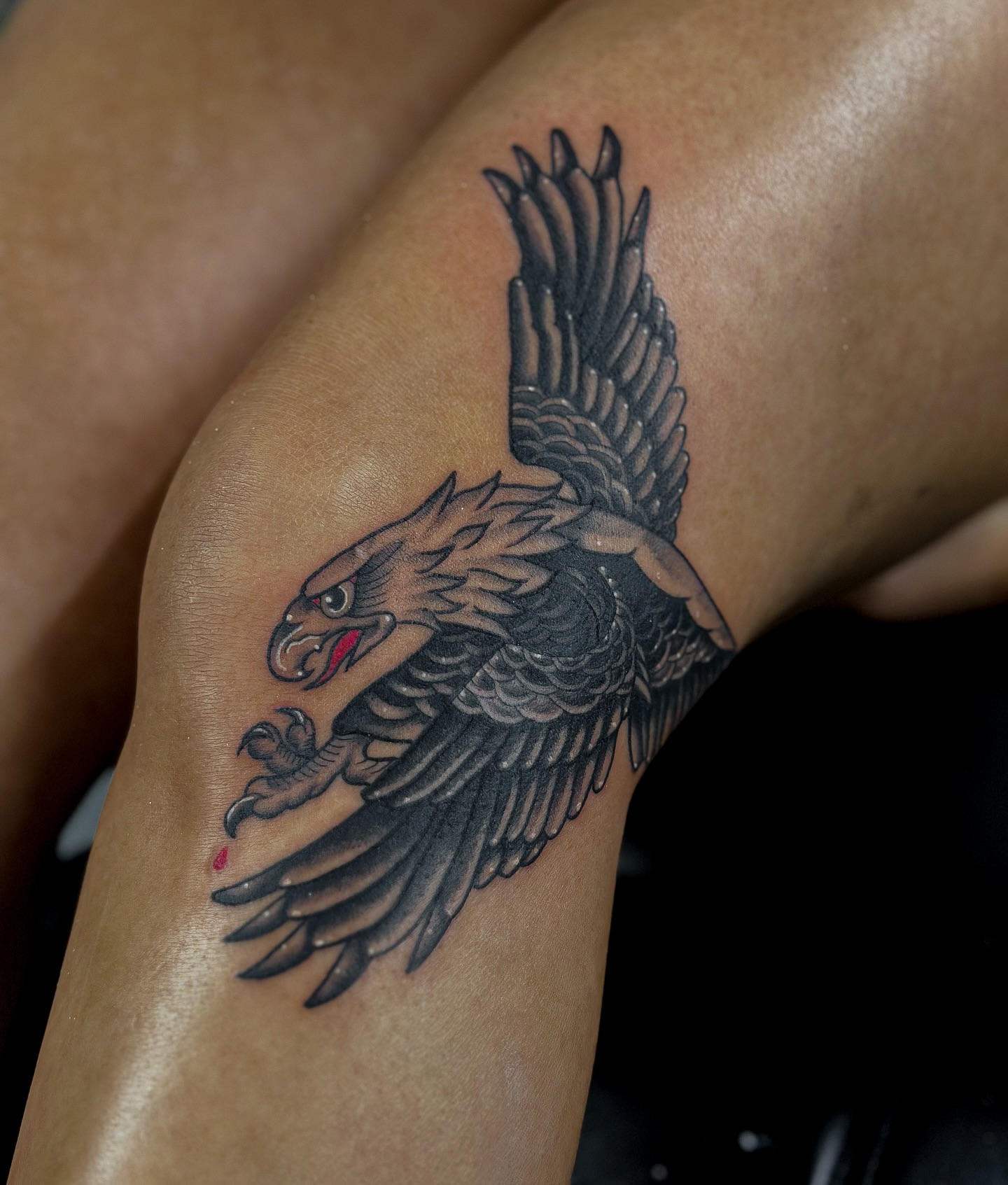 Falcon black and grey tattoo on the thigh by Sincere