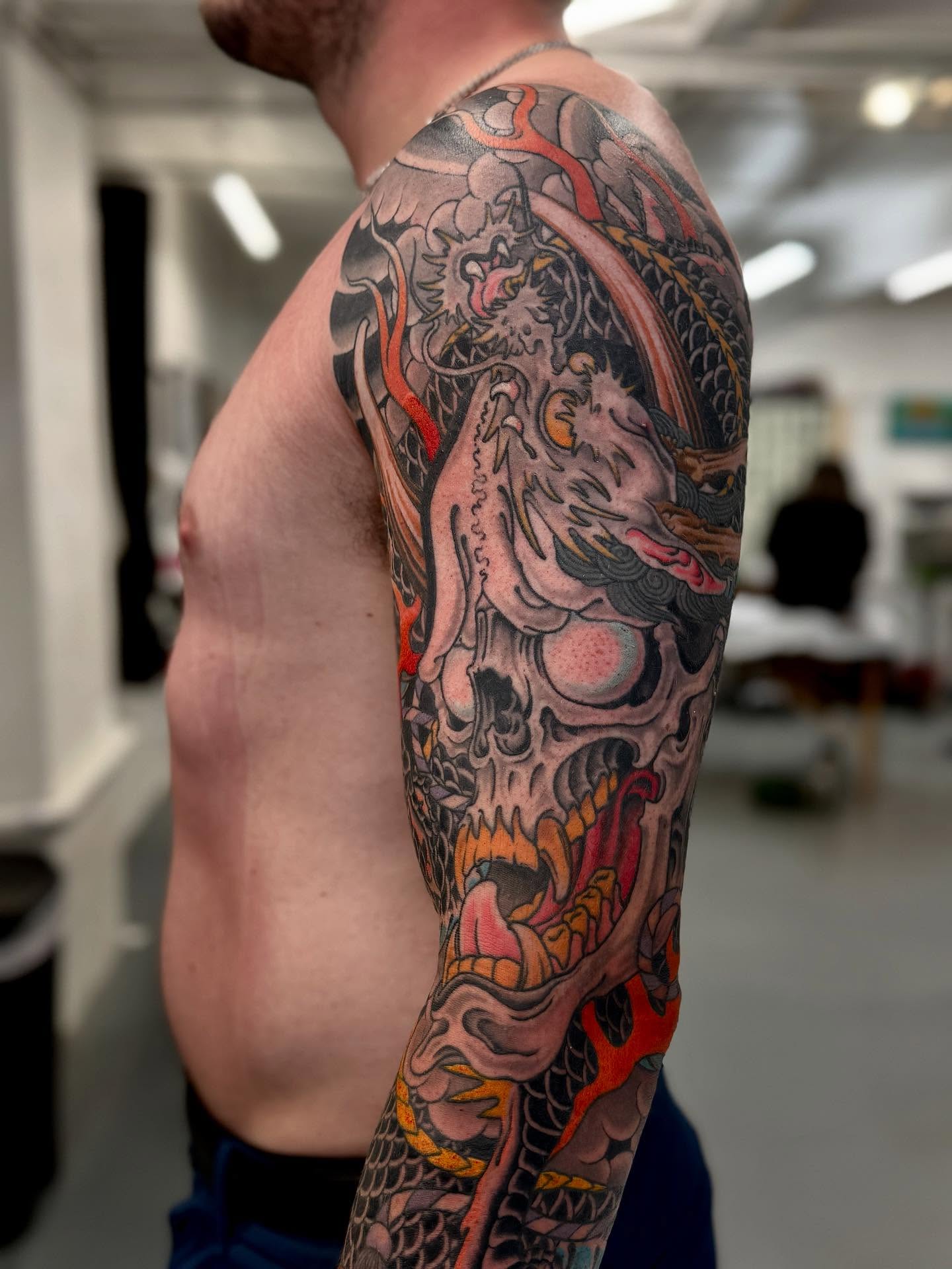 Dragon and skull japanese irezumi tattoo on the upper arm by Cole Pittman Memphis Tattoo artist, Memphis, Tennessee