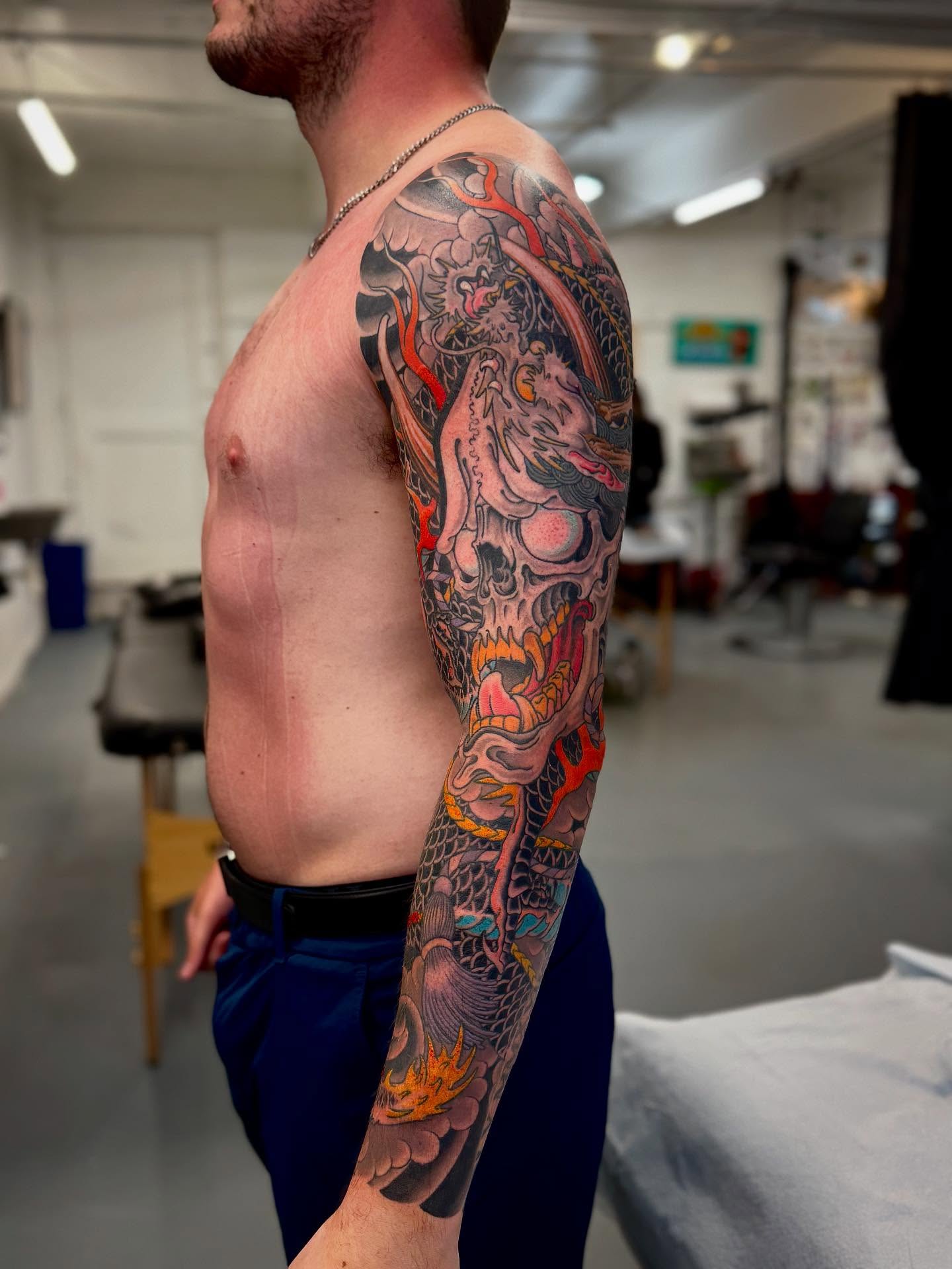 Skull and dragon japanese irezumi tattoo on the upper arm by Cole Pittman Memphis Tattoo artist, Memphis, Tennessee