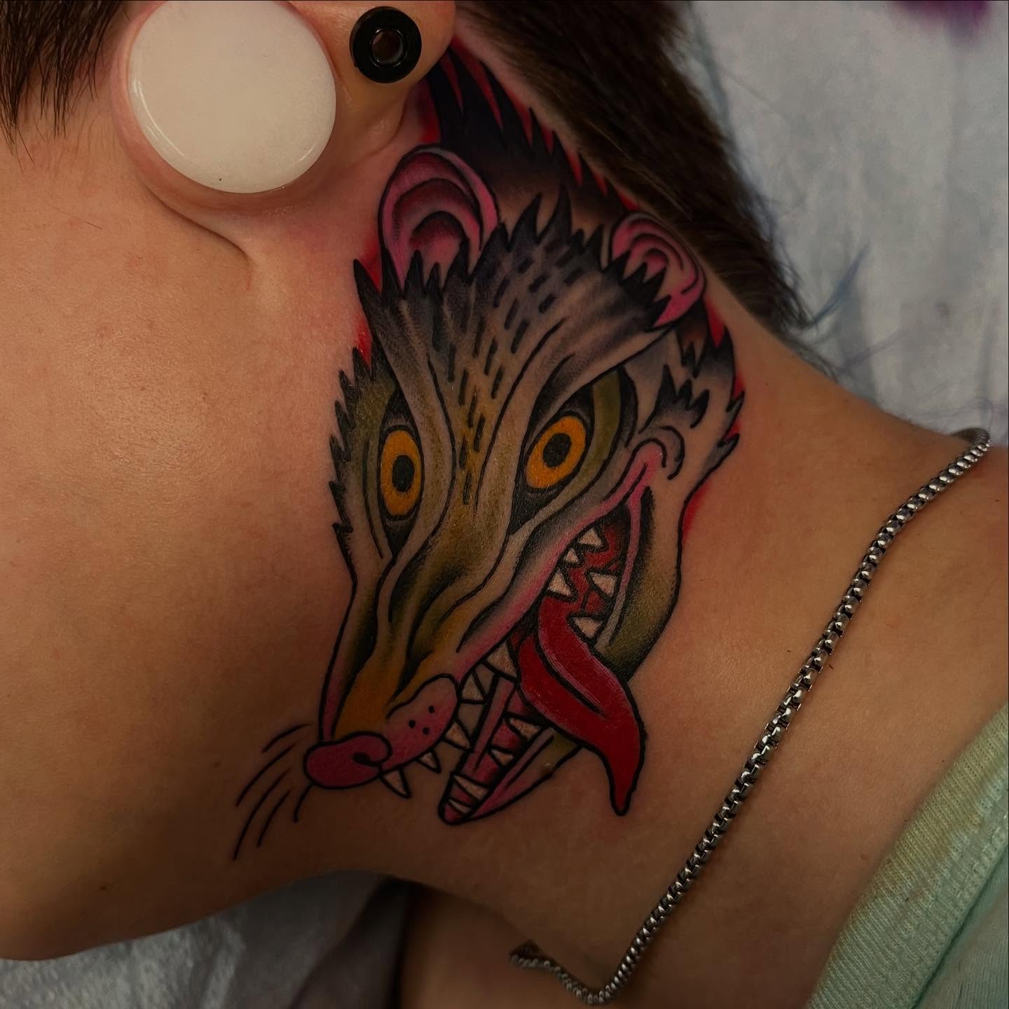 Wolf head American traditional tattoo on the shoulder by Lee Brewster, Erlanger, Kentucky