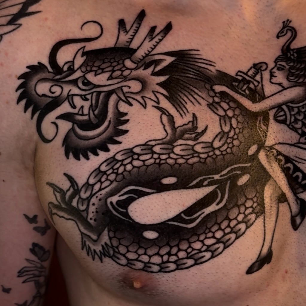 Dragon and woman black and grey tattoo on the chest by Cory Allen
