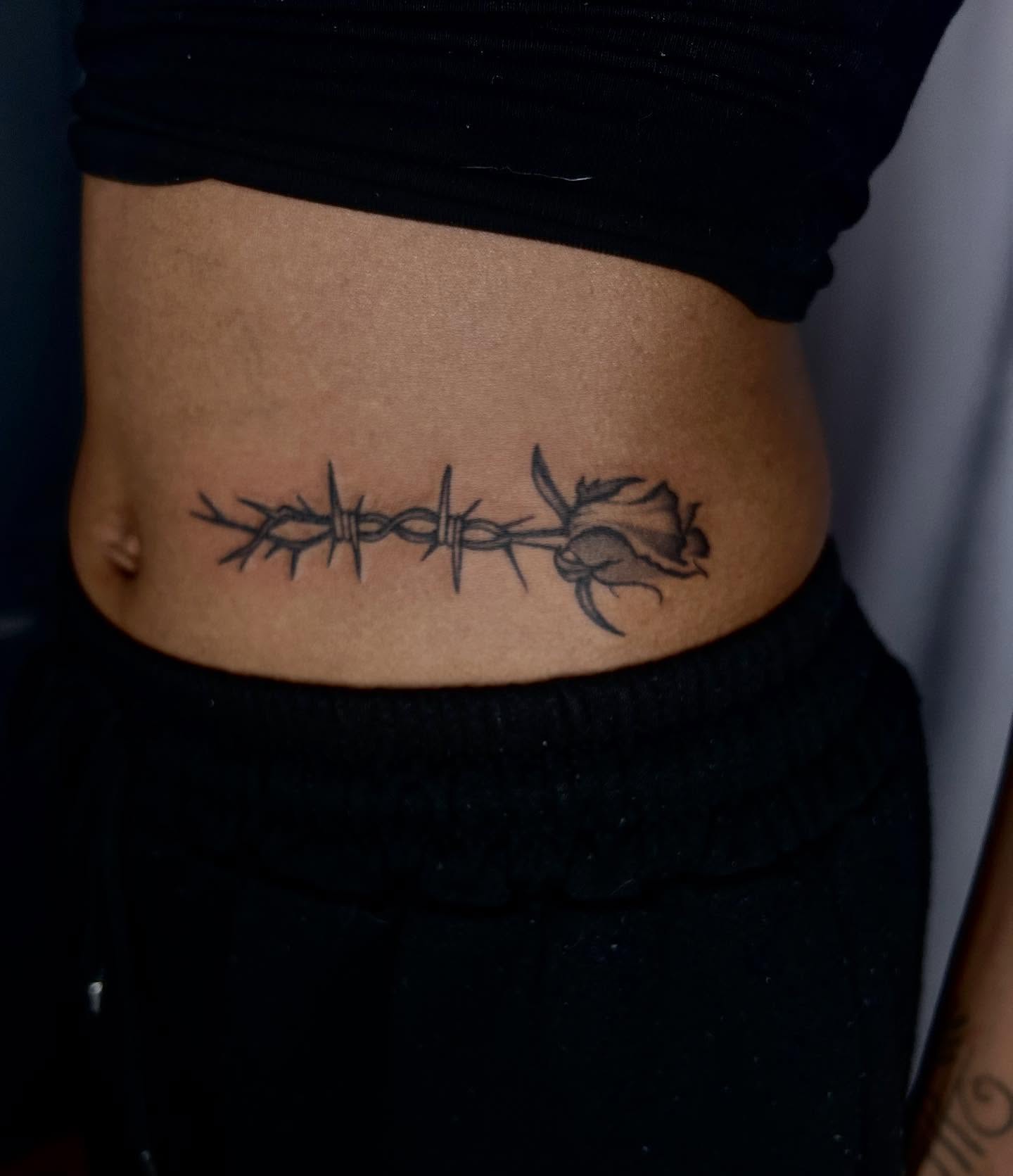 Barbed wire and rose black and grey tattoo on the torso by Tash ๐โ๐ฉ