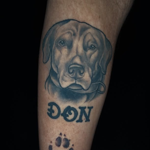Dog head realism tattoo on the forearm by John Milosh Chamberlin