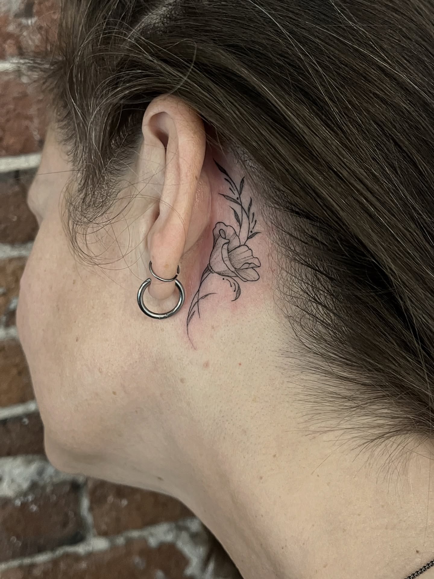 Flower black and grey tattoo on the neck by Lo Gwynn