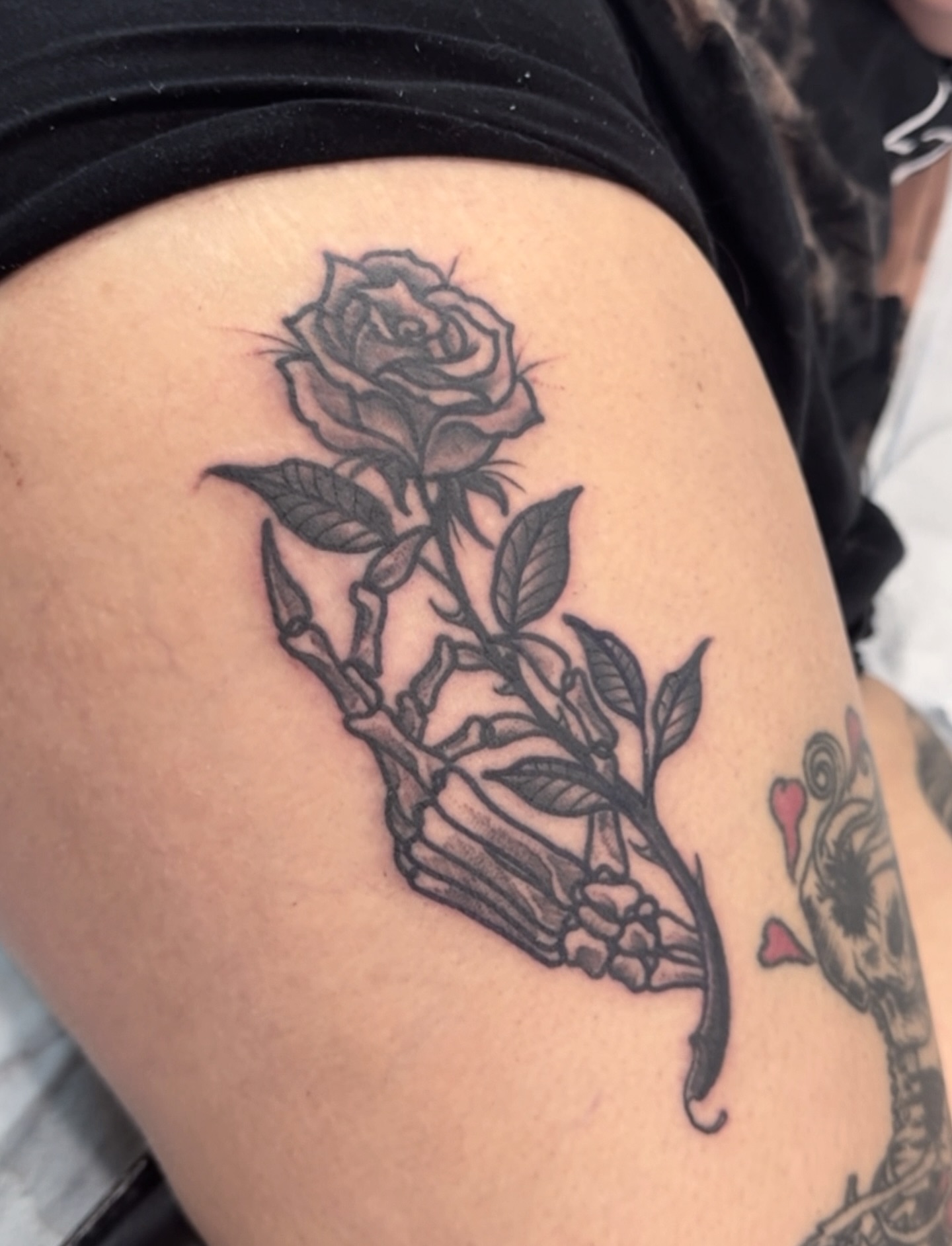 Rose black and grey tattoo on the thigh by Brian DiCola Tattooer