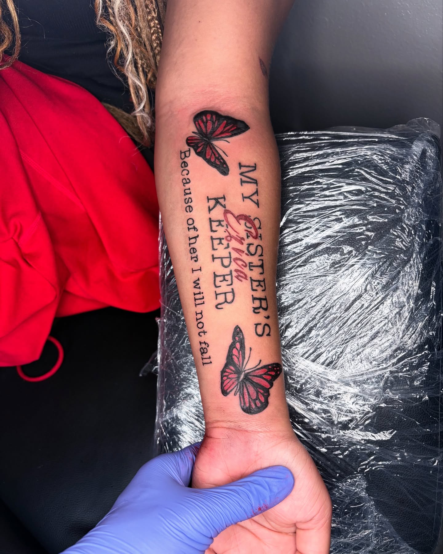 Butterfly and text dotwork tattoo on the forearm by Maleek Inkz