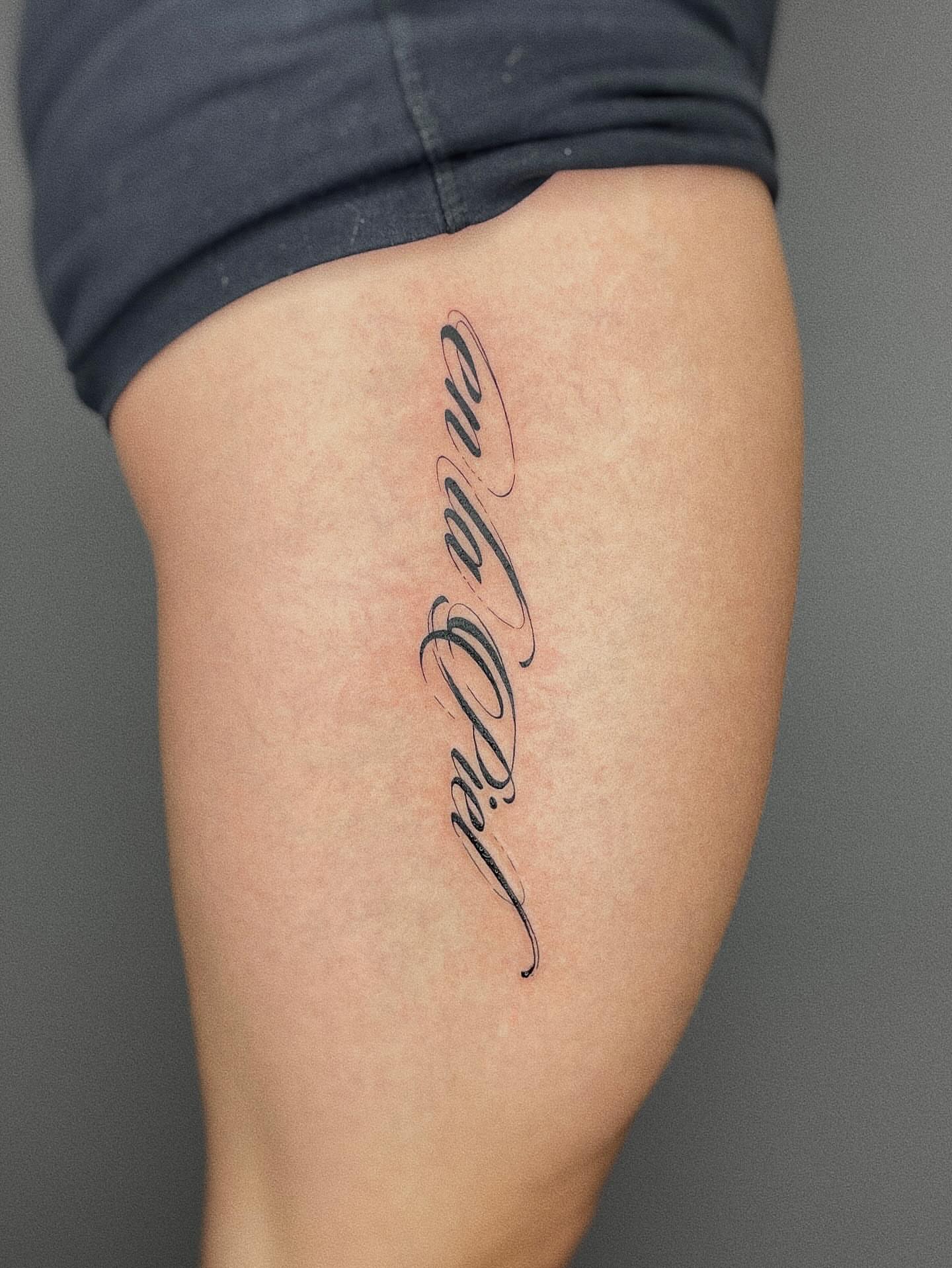 Script lettering lettering script tattoo on the thigh by Thiên Hồ