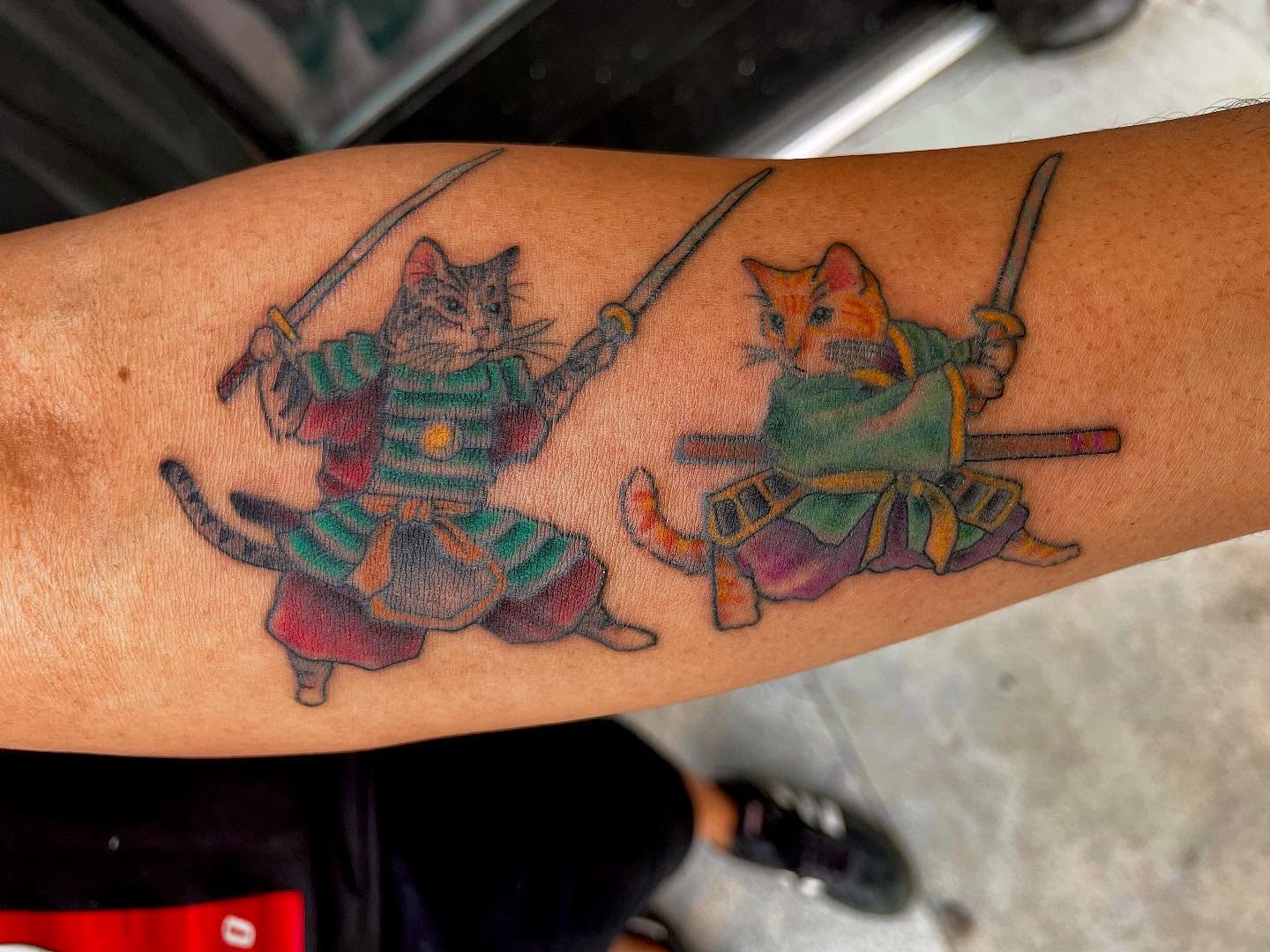 Cats in samurai armor dotwork tattoo on the forearm by Lake Stephens, Richmond, Virginia