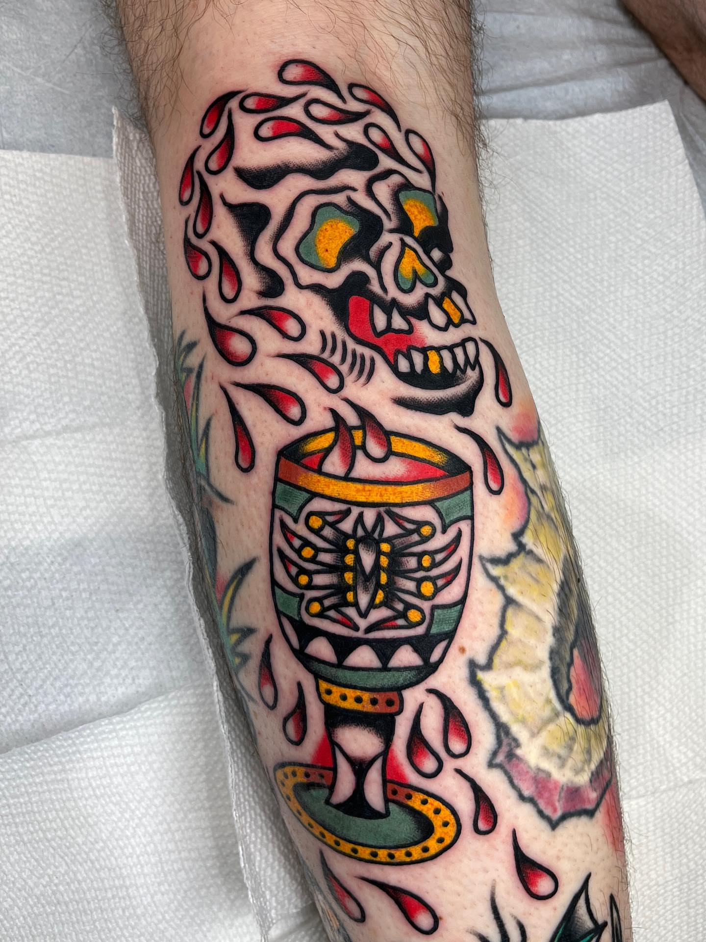 Skull and chalice American traditional tattoo on the forearm by Charlie Ostrom, Durham, North Carolina