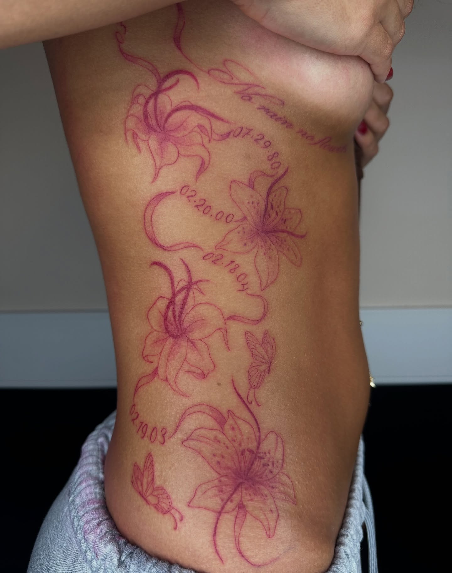 Lilies and butterflies fine line tattoo on the thigh by sechi