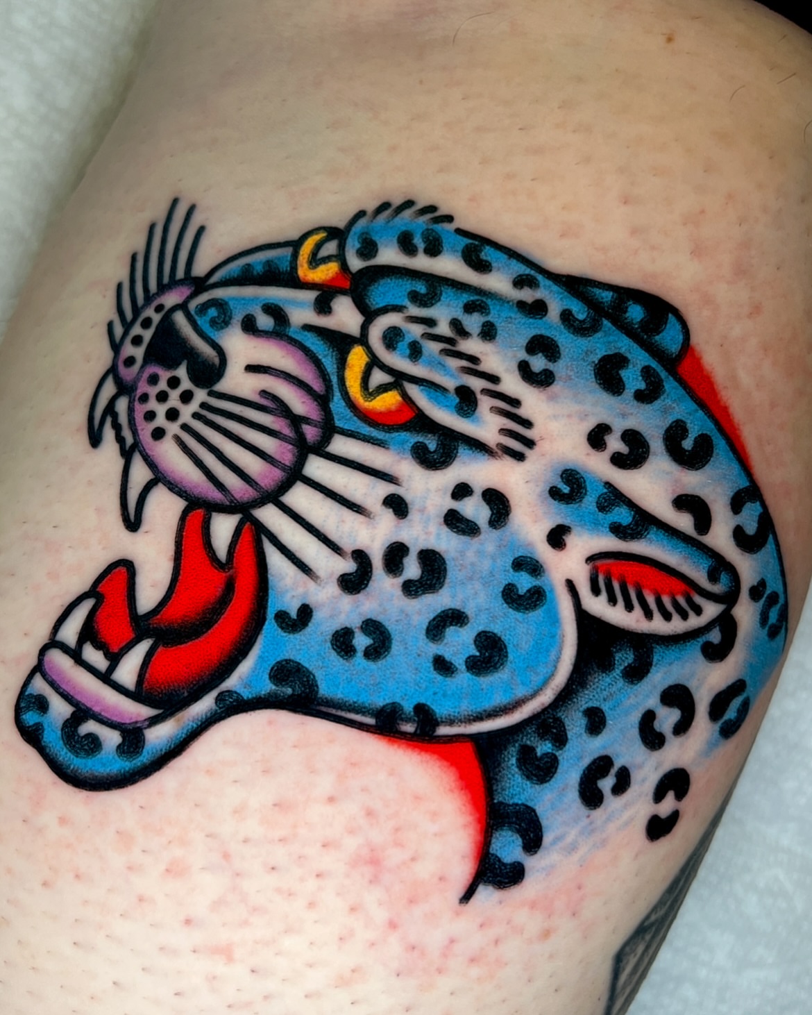 Panther American traditional tattoo on the shoulder by Ian Jett