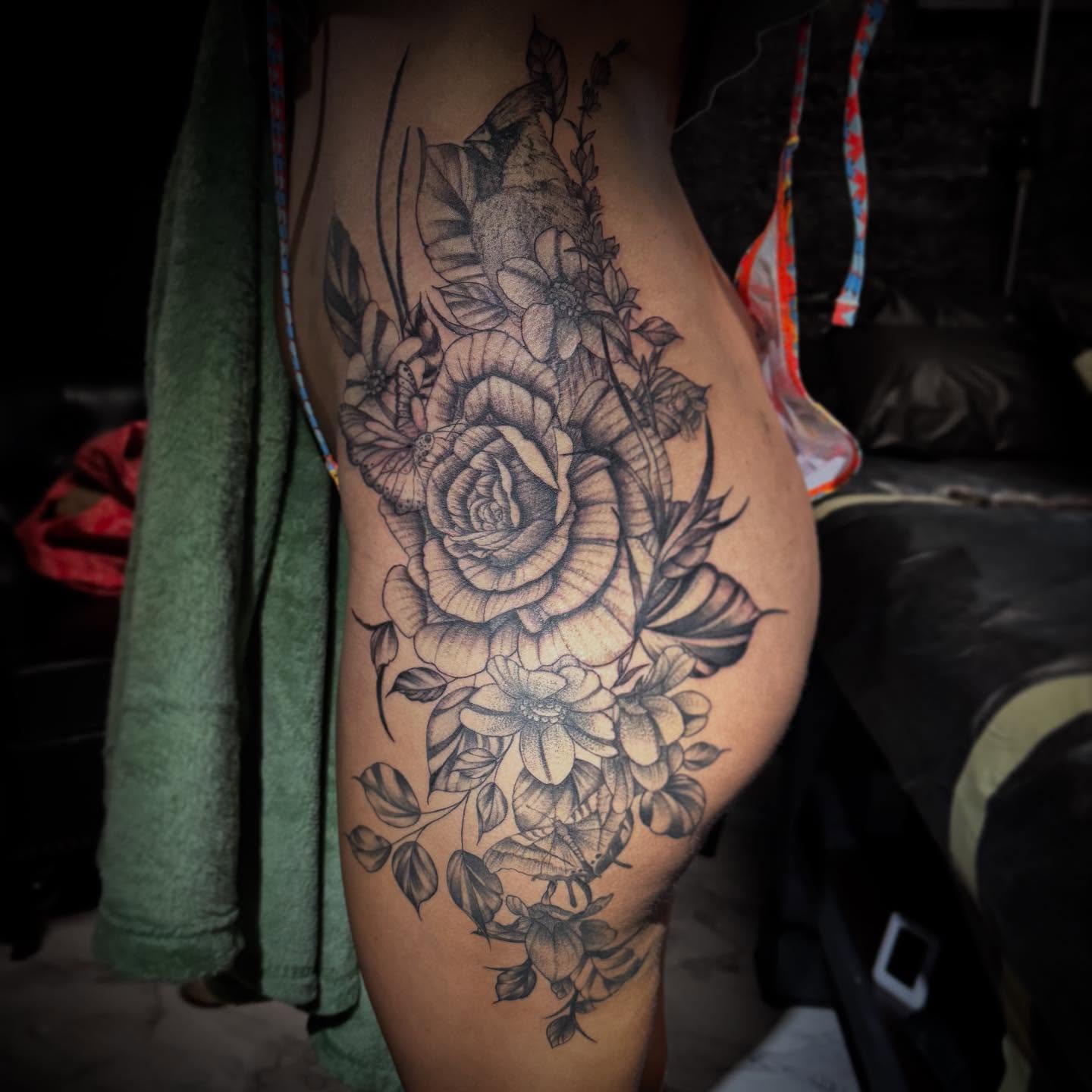 Floral bouquet realism tattoo on the thigh by AaronAdlerTattoos.com, Cincinnati