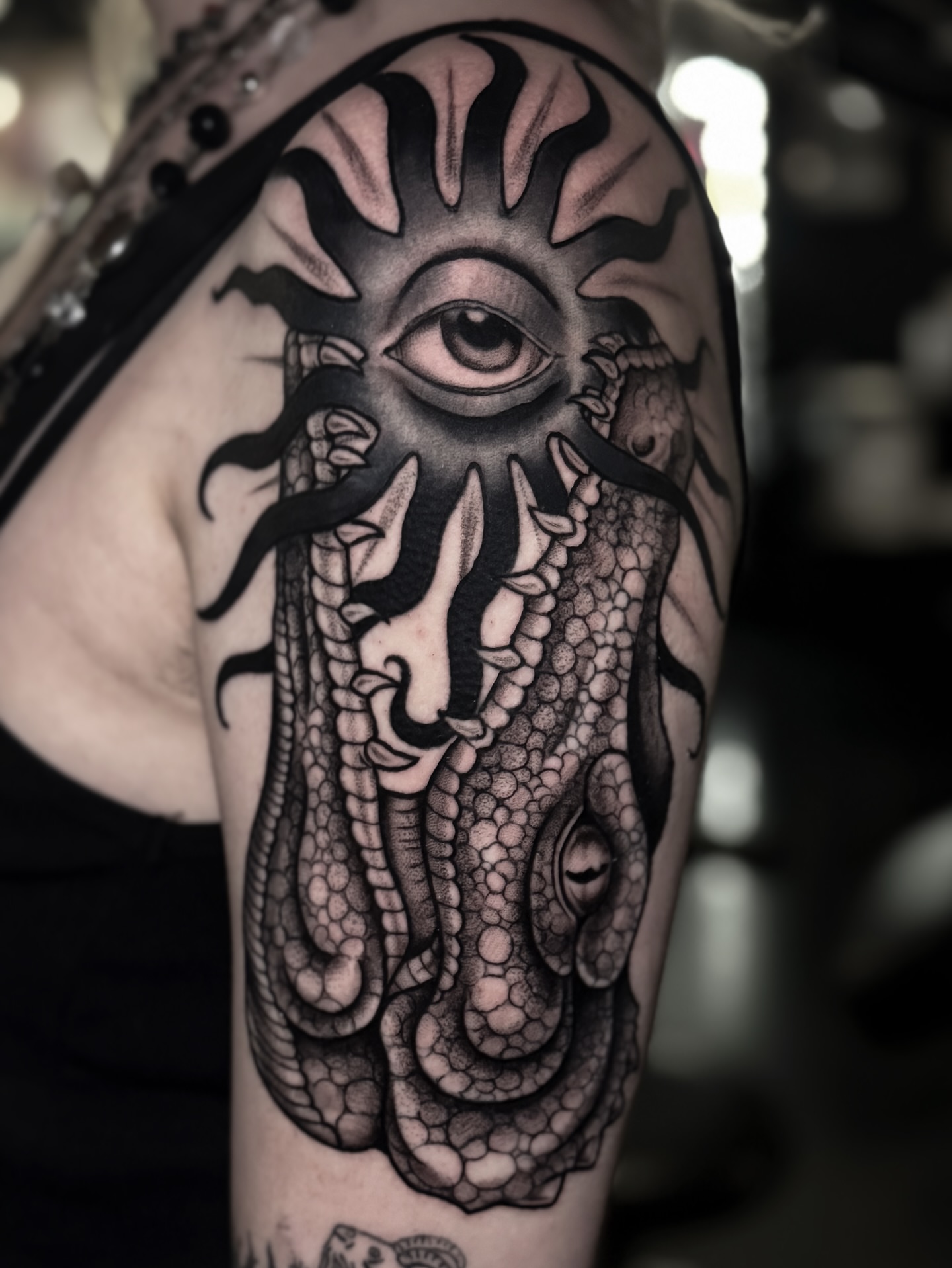 Eye and tentacles realism tattoo on the shoulder by Cristen Aro