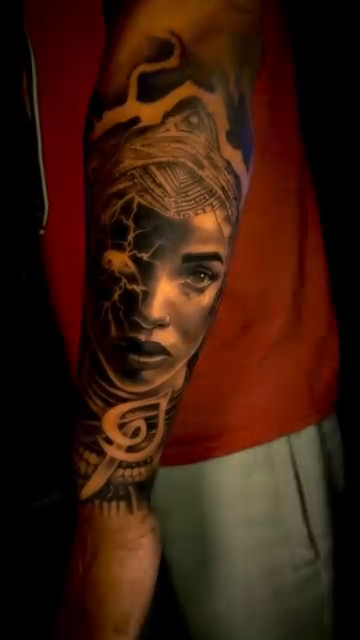Woman's face with abstract elements realism tattoo by Greg Petrali