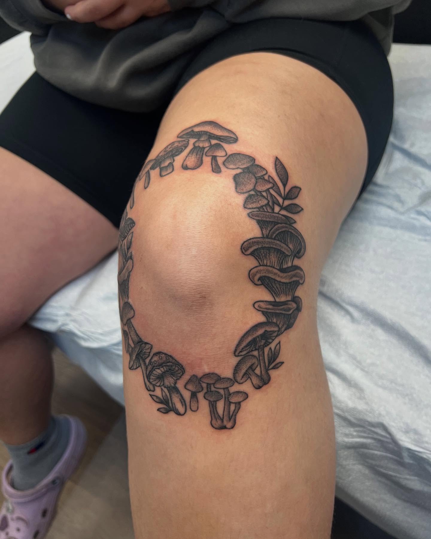 Mushroom cluster black and grey tattoo on the thigh by Cody Marl