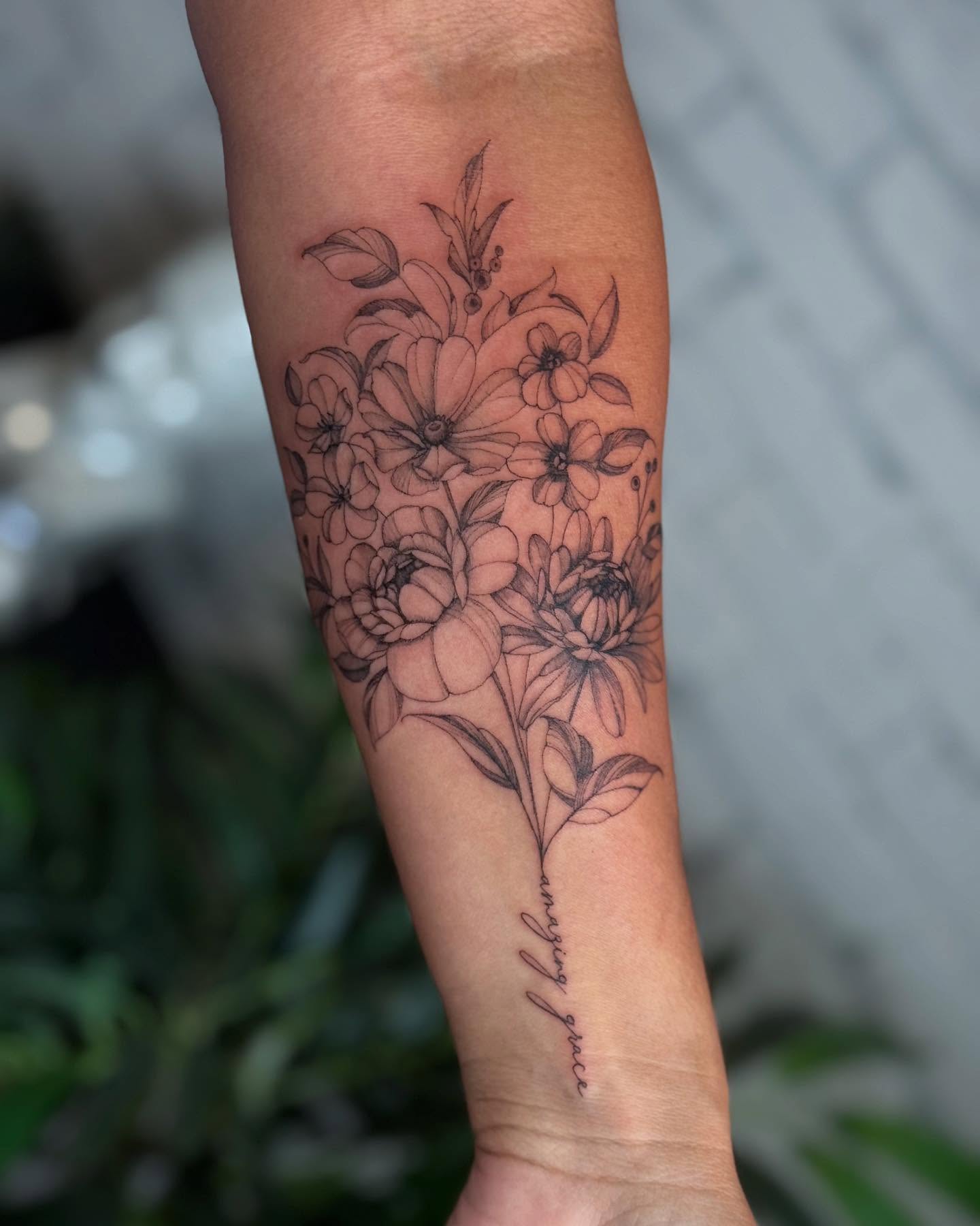 Floral bouquet black and grey tattoo on the forearm by ❀ Moo, Mount Laurel, New Jersey