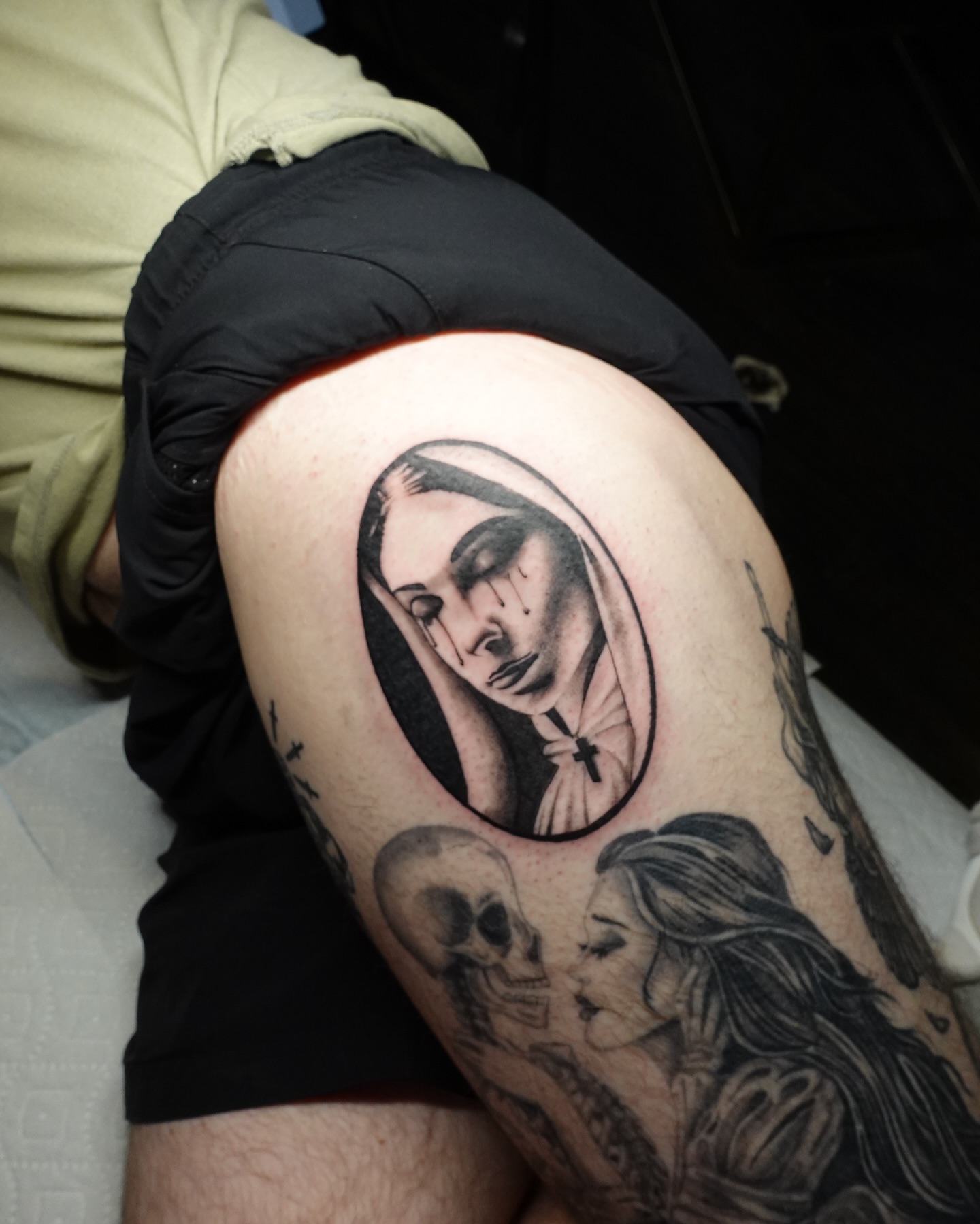 Religious nun realism tattoo on the thigh by Tat by Brendan