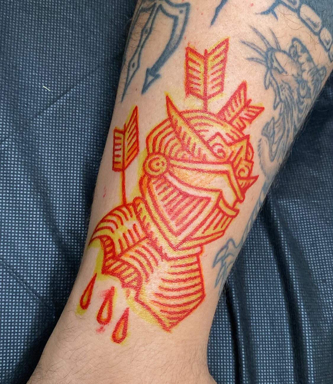 Warrior helmet American traditional tattoo on the forearm by Morgana Sutherland