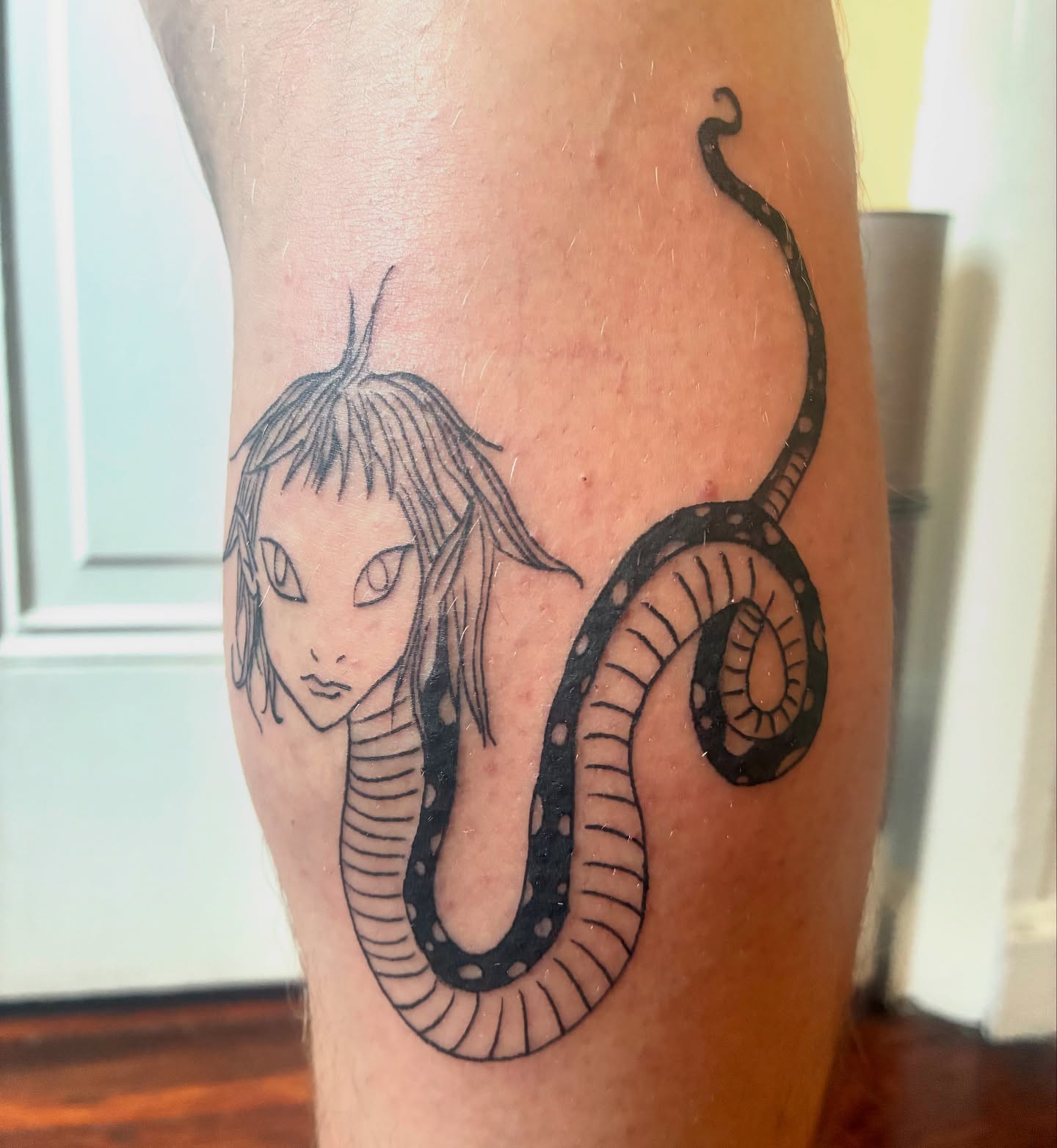 Snake and woman realism tattoo on the forearm by Steph Liebetreu