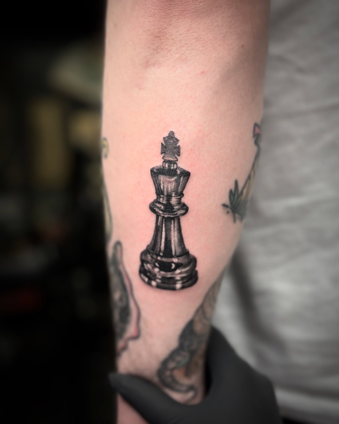 Chess king black and grey tattoo on the forearm by ✩ 🕯️☾༺♰ gracey ༻☽🕯️✩