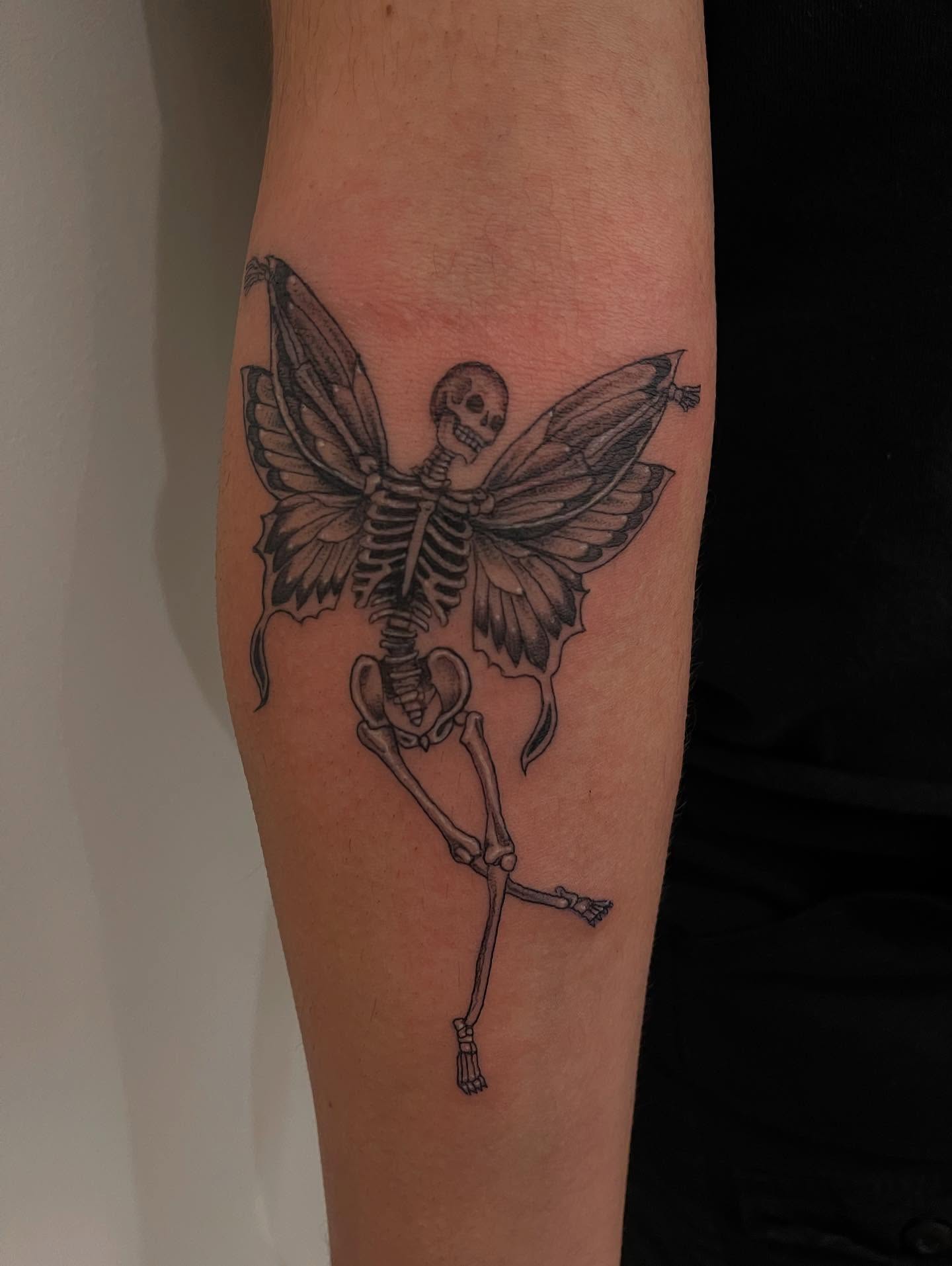 Skeleton fairy black and grey tattoo on the forearm by ដេវី  និល - Davi Nil - Tattoo Artist