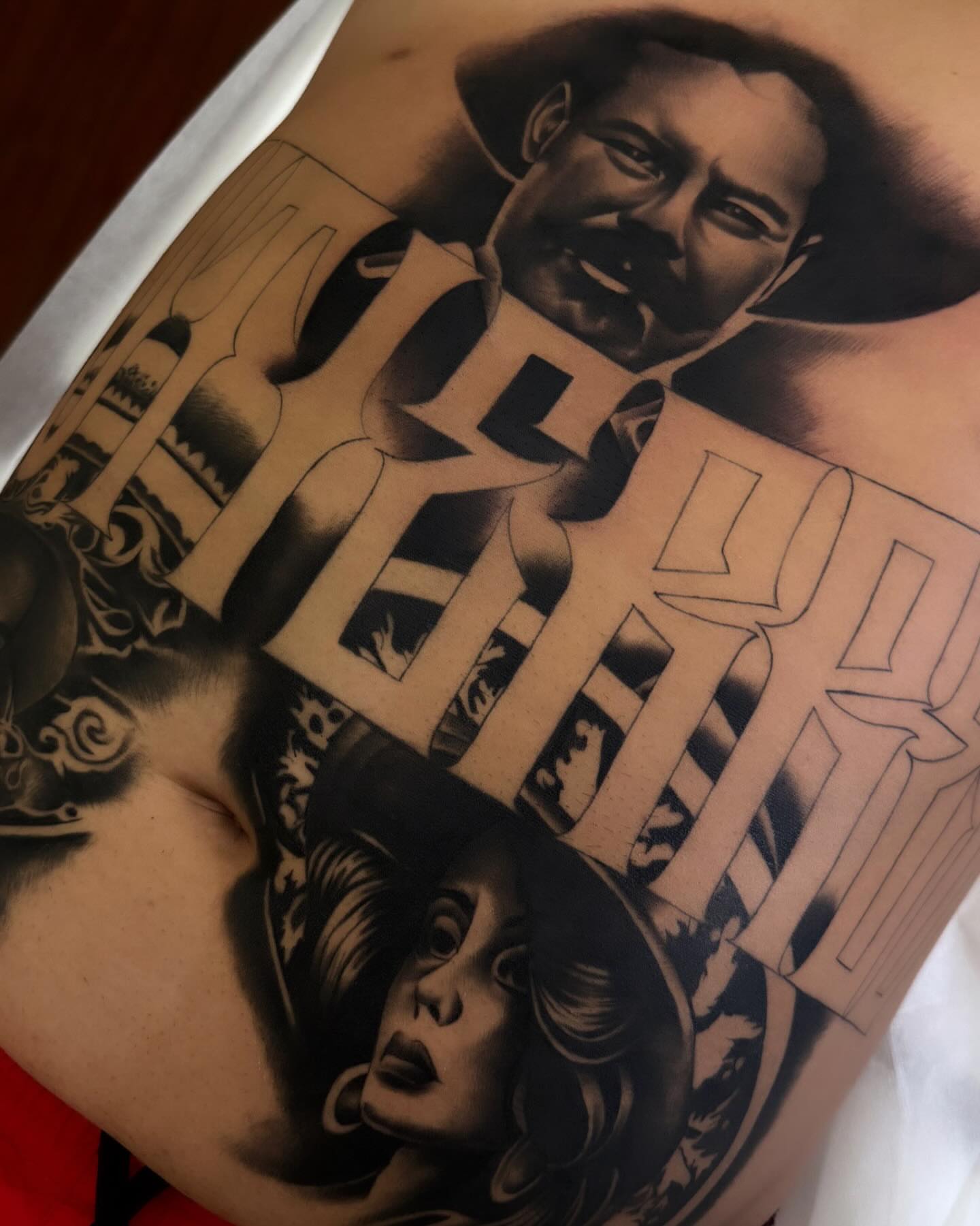 Portrait and text realism tattoo on the torso by TattooBoyTattoos