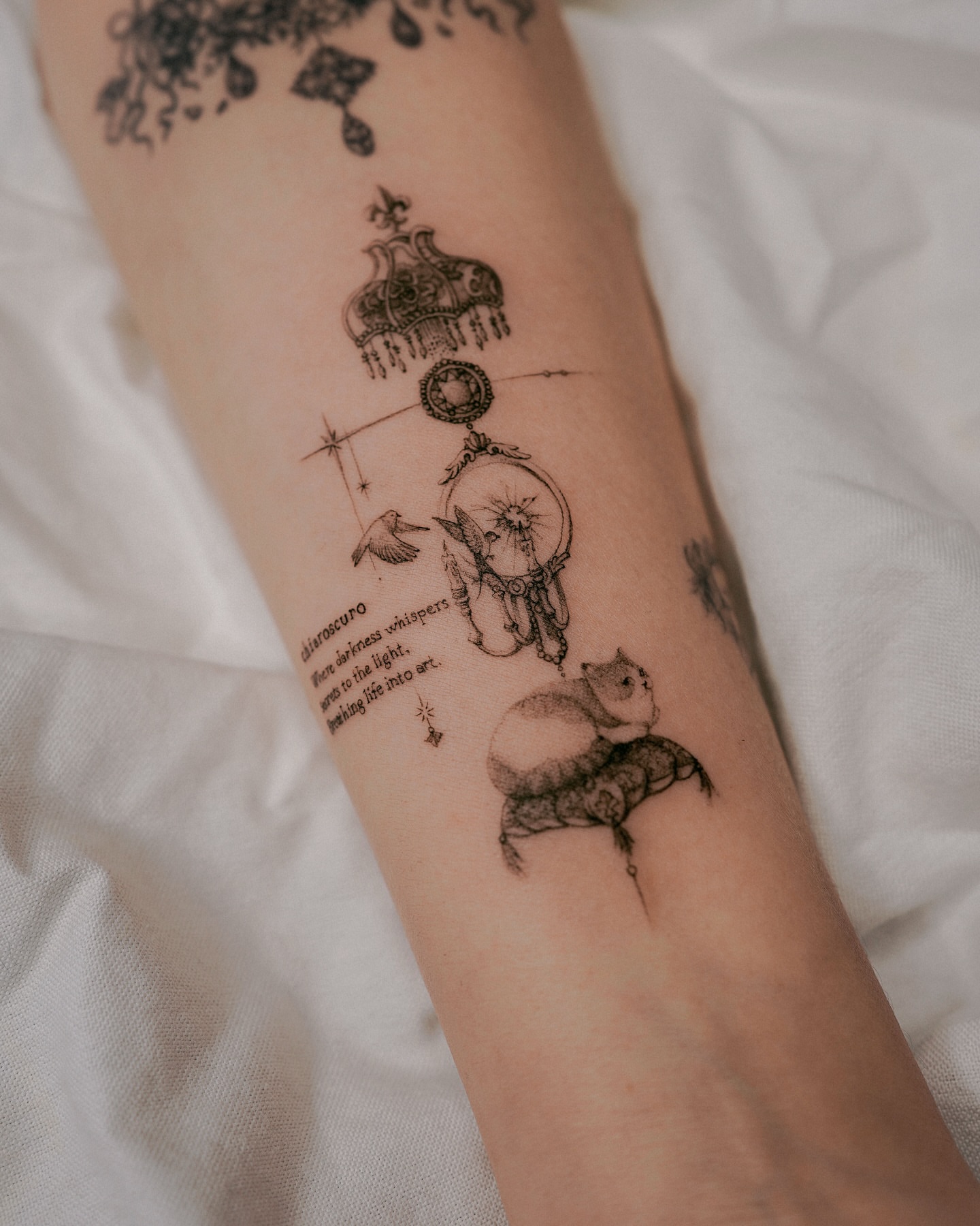 Dreamcatcher and bear illustrative tattoo on the forearm by Yeonji