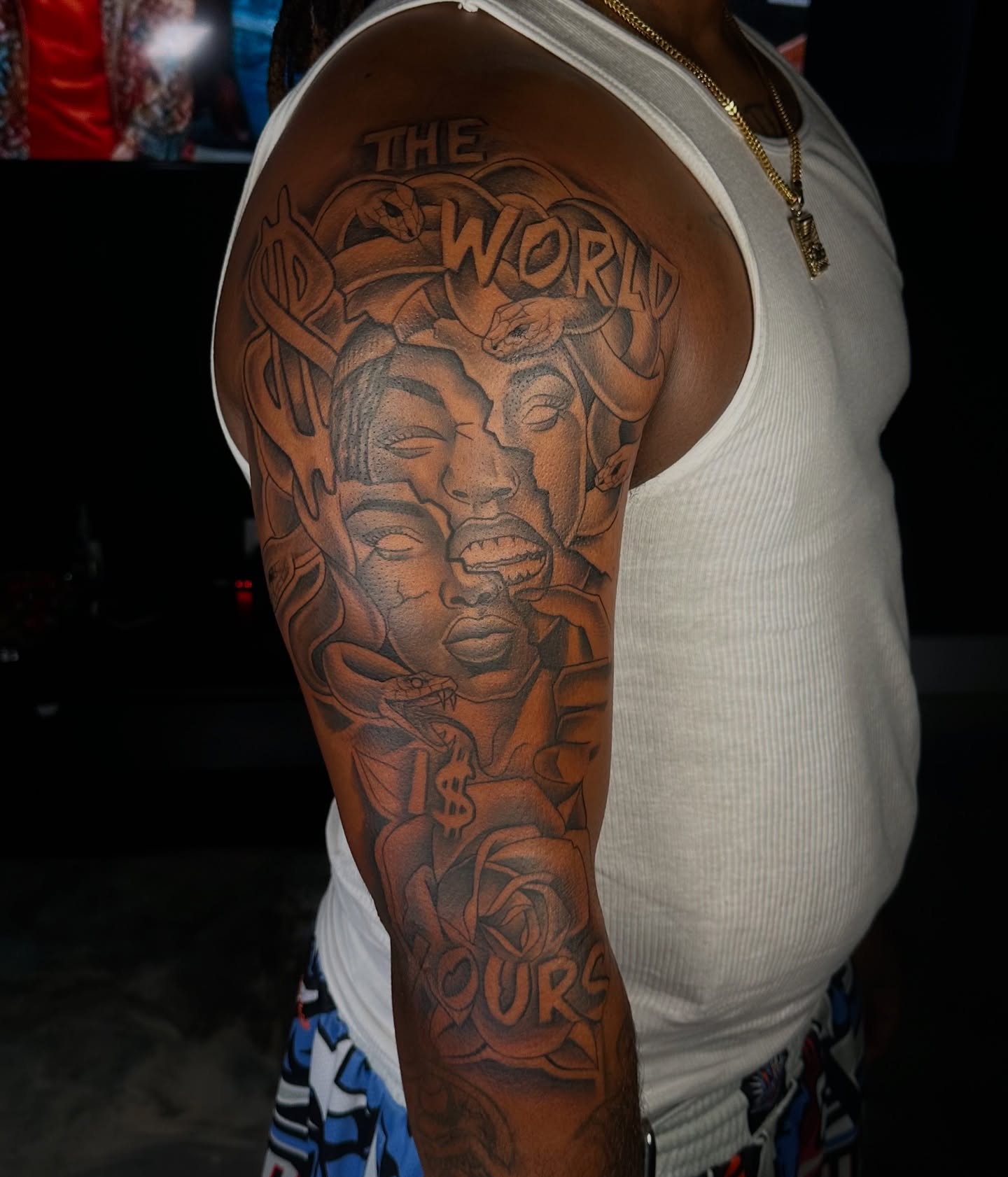 The world ours black and grey tattoo on the upper arm by Jay Daartist