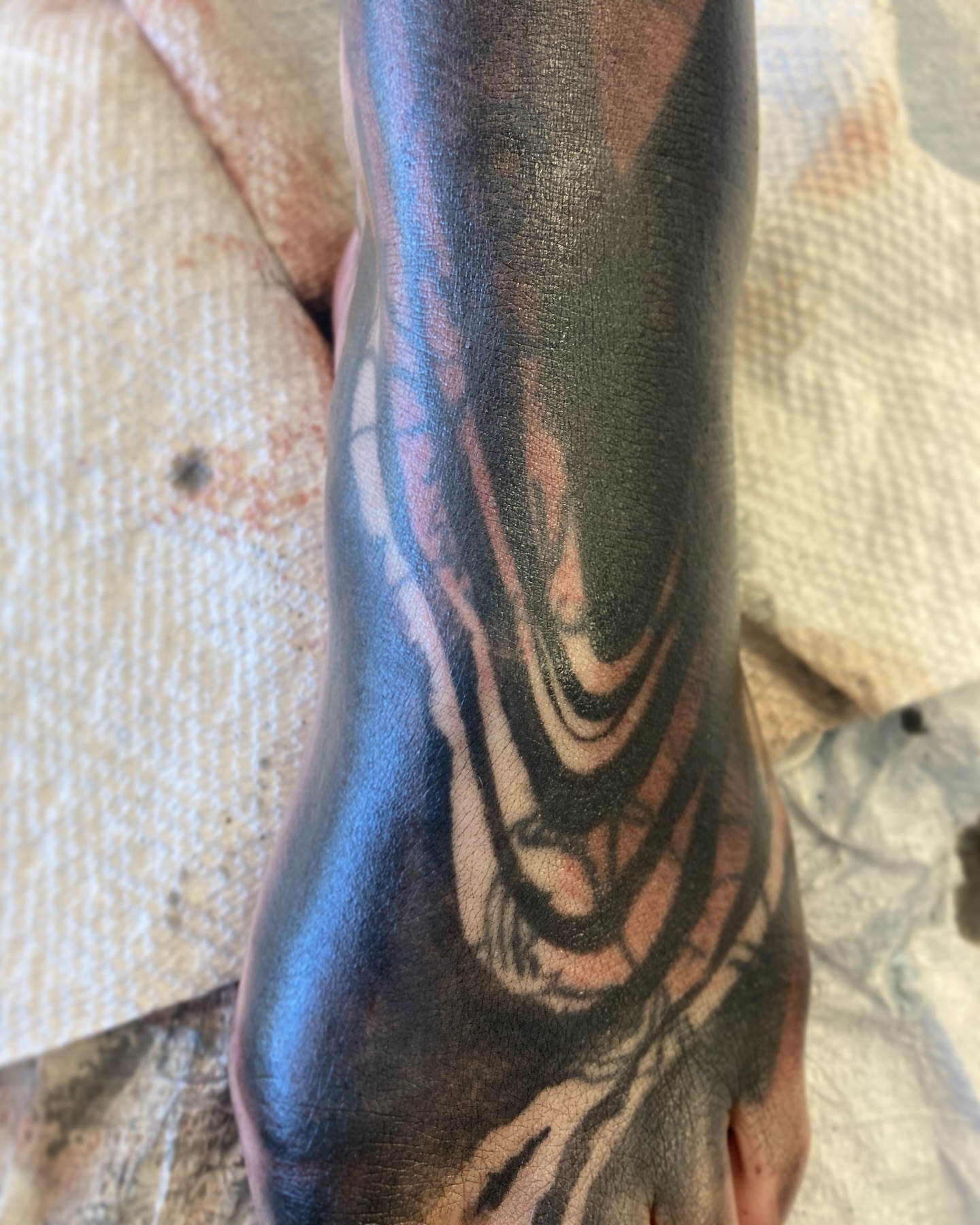 Abstract design black and grey tattoo on the forearm by Rizzie D'Alterio