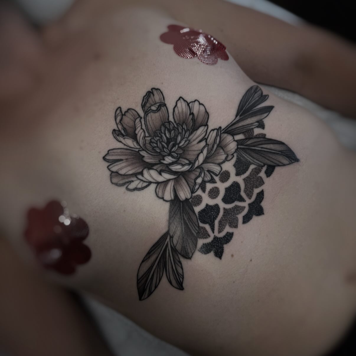 Peony flower black and grey tattoo on the ribs by gina