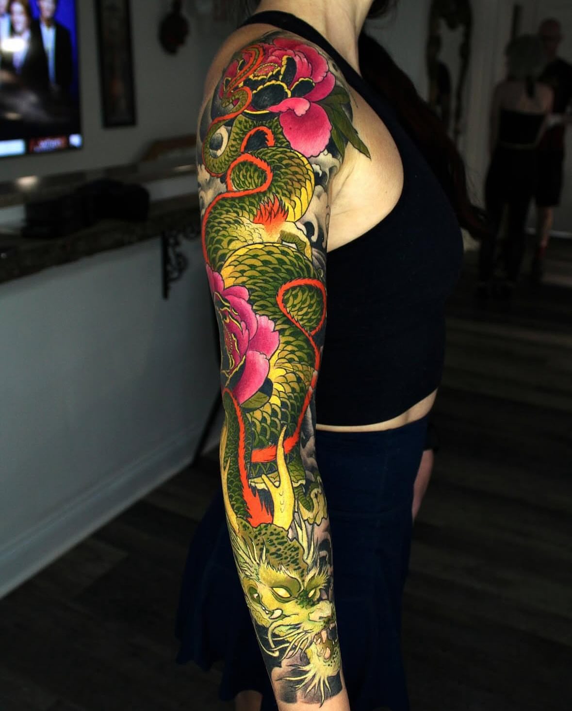 Dragon and peonies japanese irezumi tattoo on the upper arm by Ericksen Linn