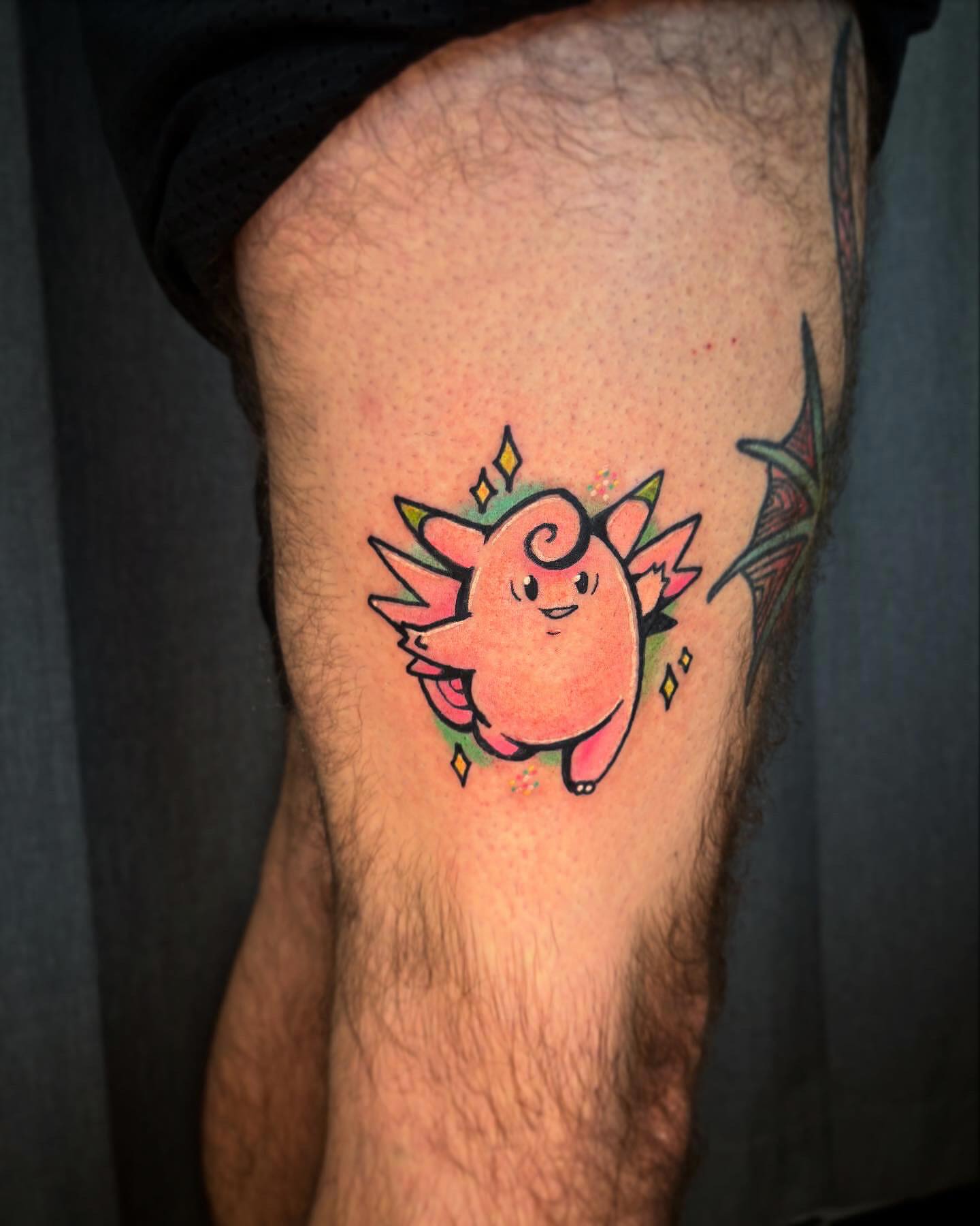 Chibi dragon new school tattoo on the thigh by Riley Oats