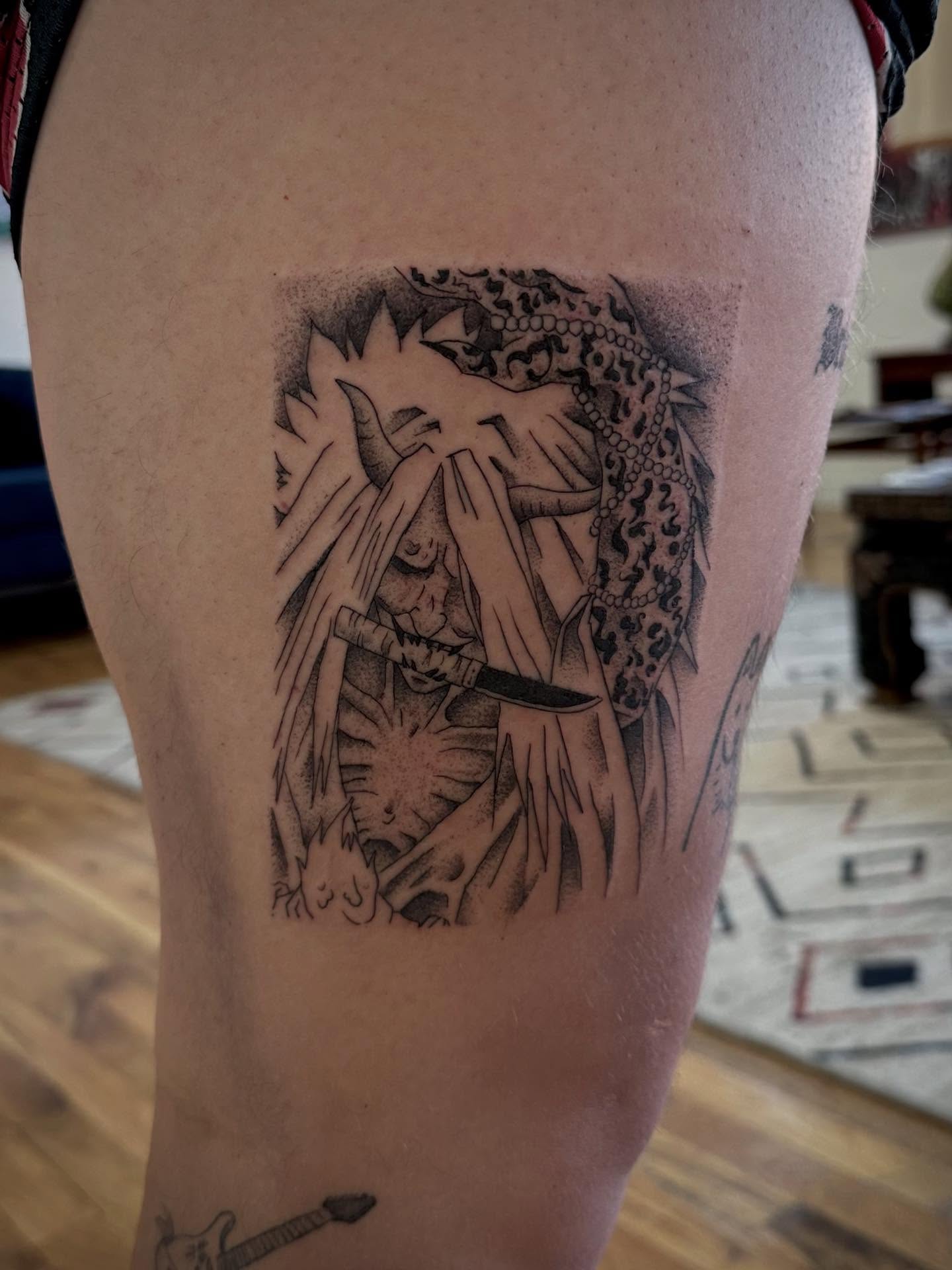 Mask and knife dotwork tattoo on the thigh by christian martinez