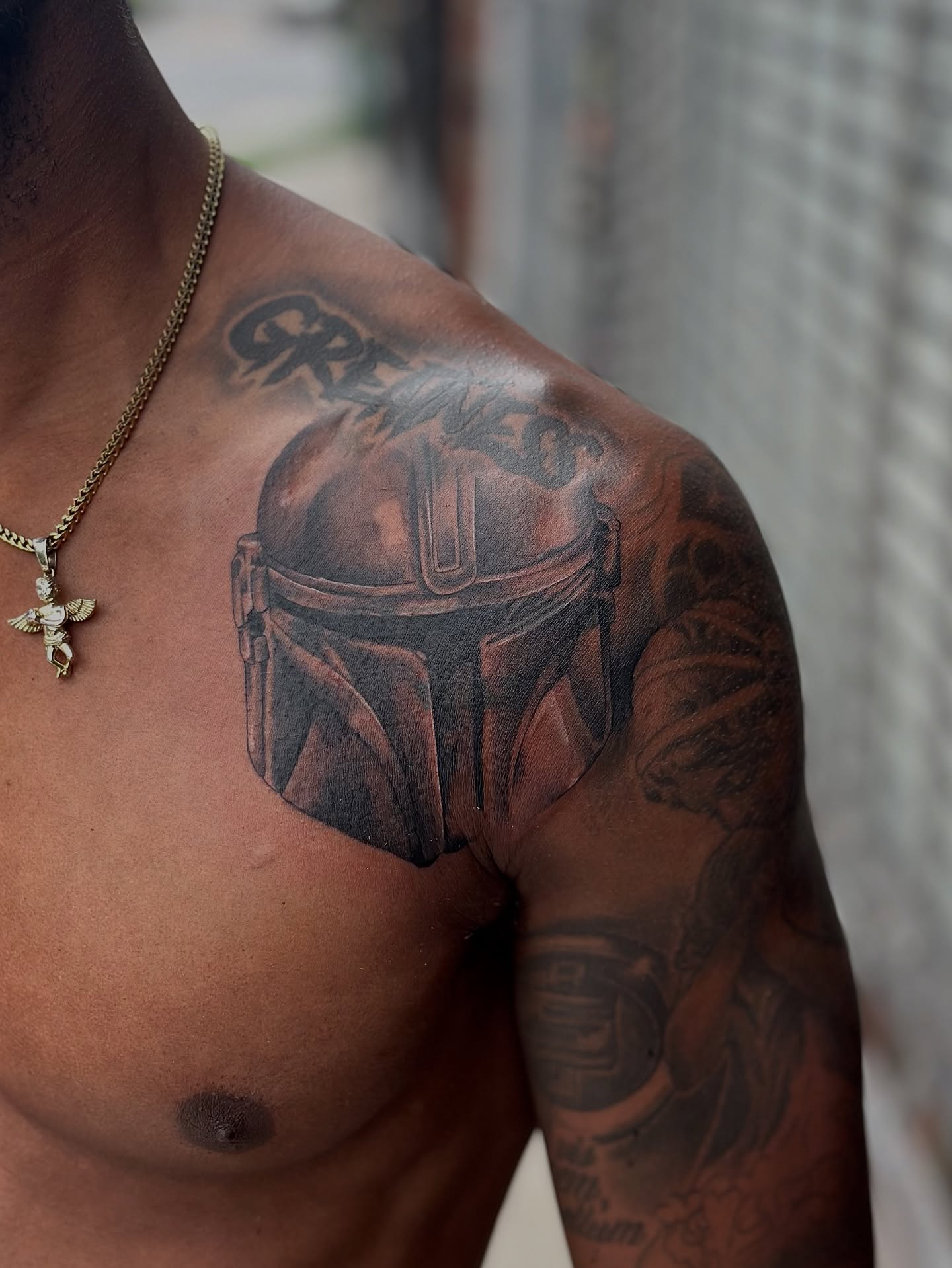 Mandalorian helmet realism tattoo on the chest by DJ 👨🏾‍🎨