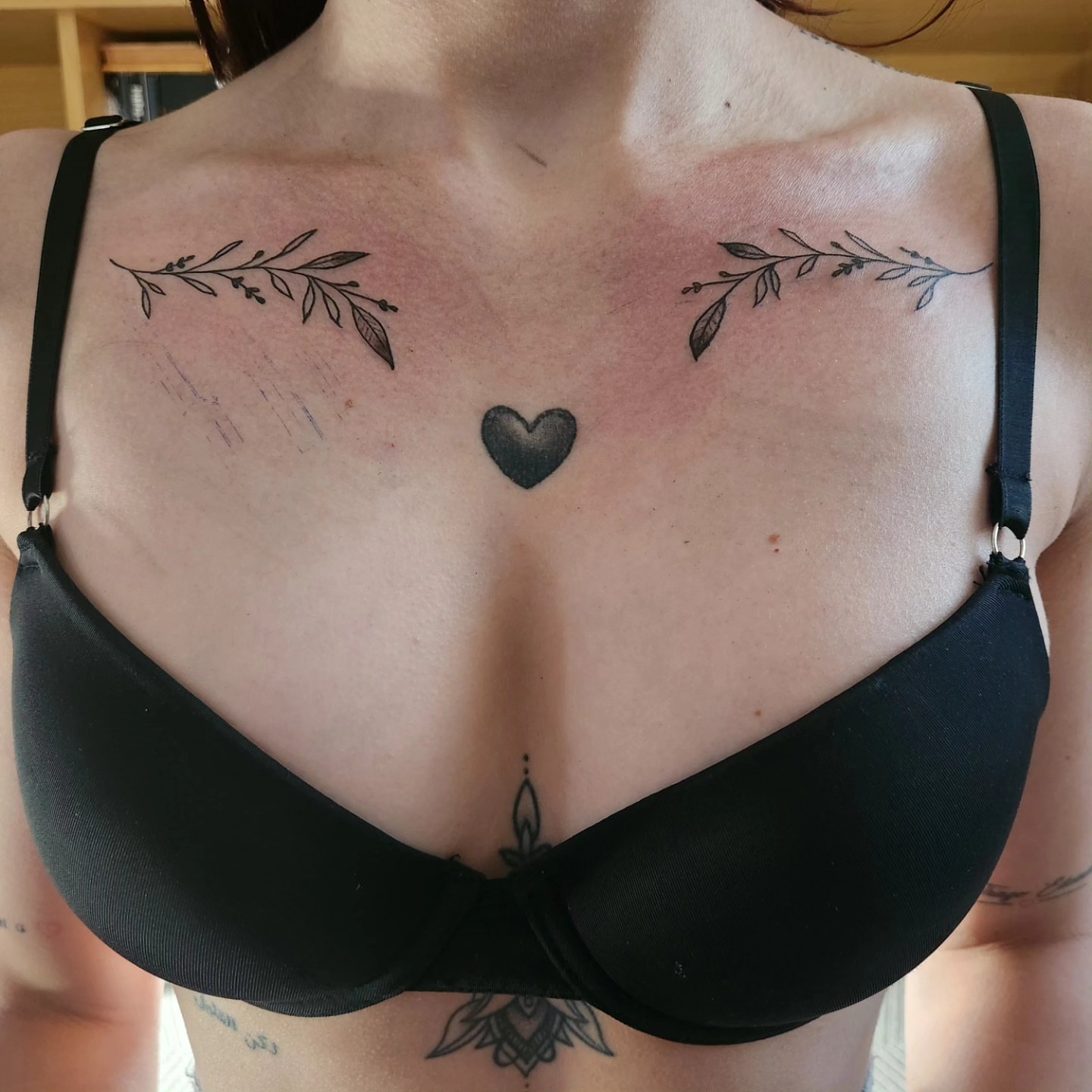 Heart and leaf black and grey tattoo on the chest by Sonia
