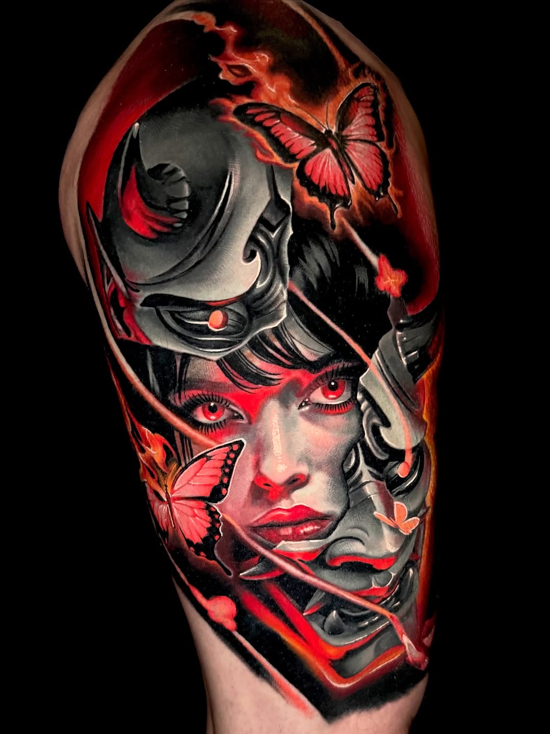 Woman with mask and butterflies surrealism tattoo on the forearm by Sean Flood