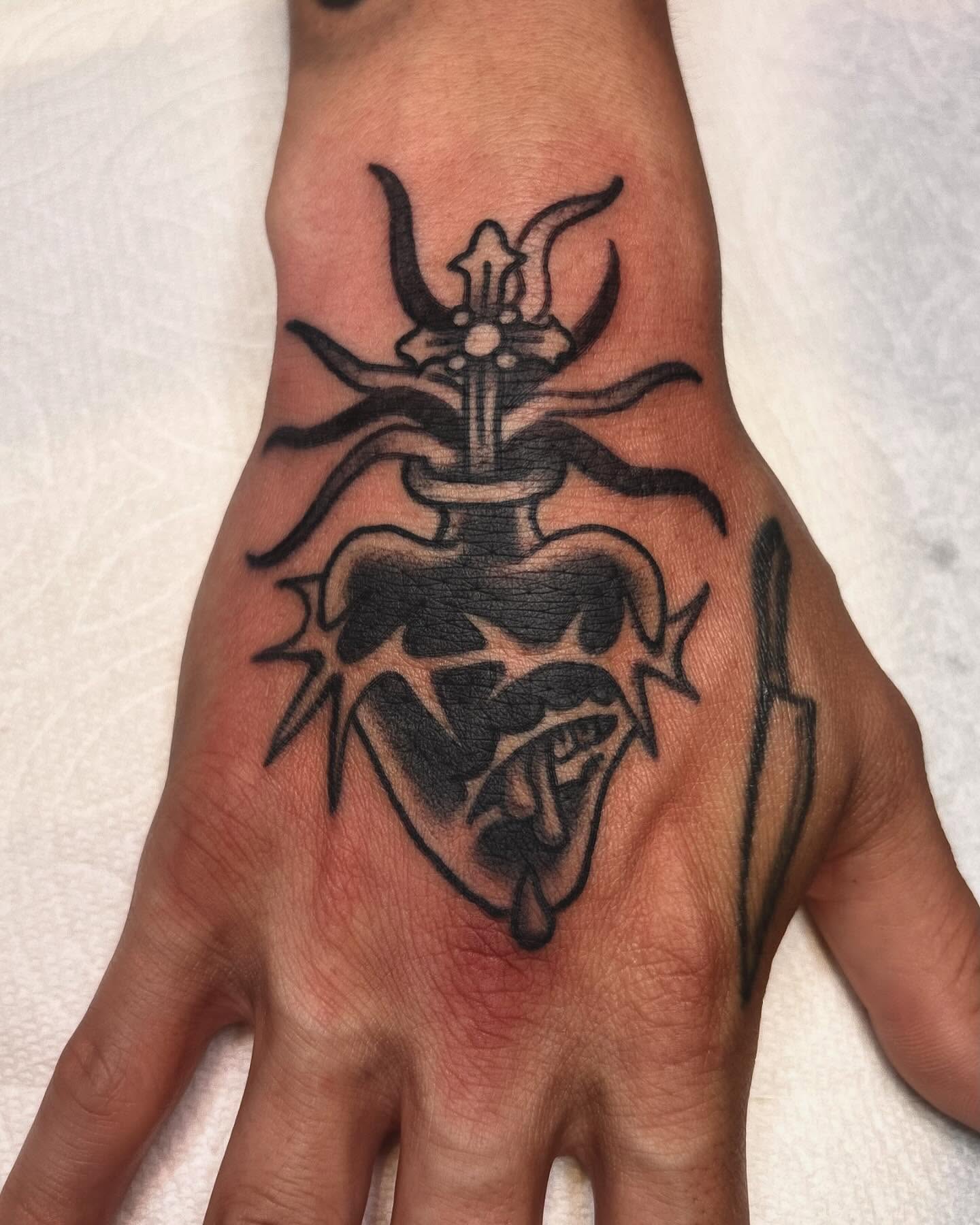 Demon heart black and grey tattoo on the hand by ๐๐๐ฏ๐ข๐ซ