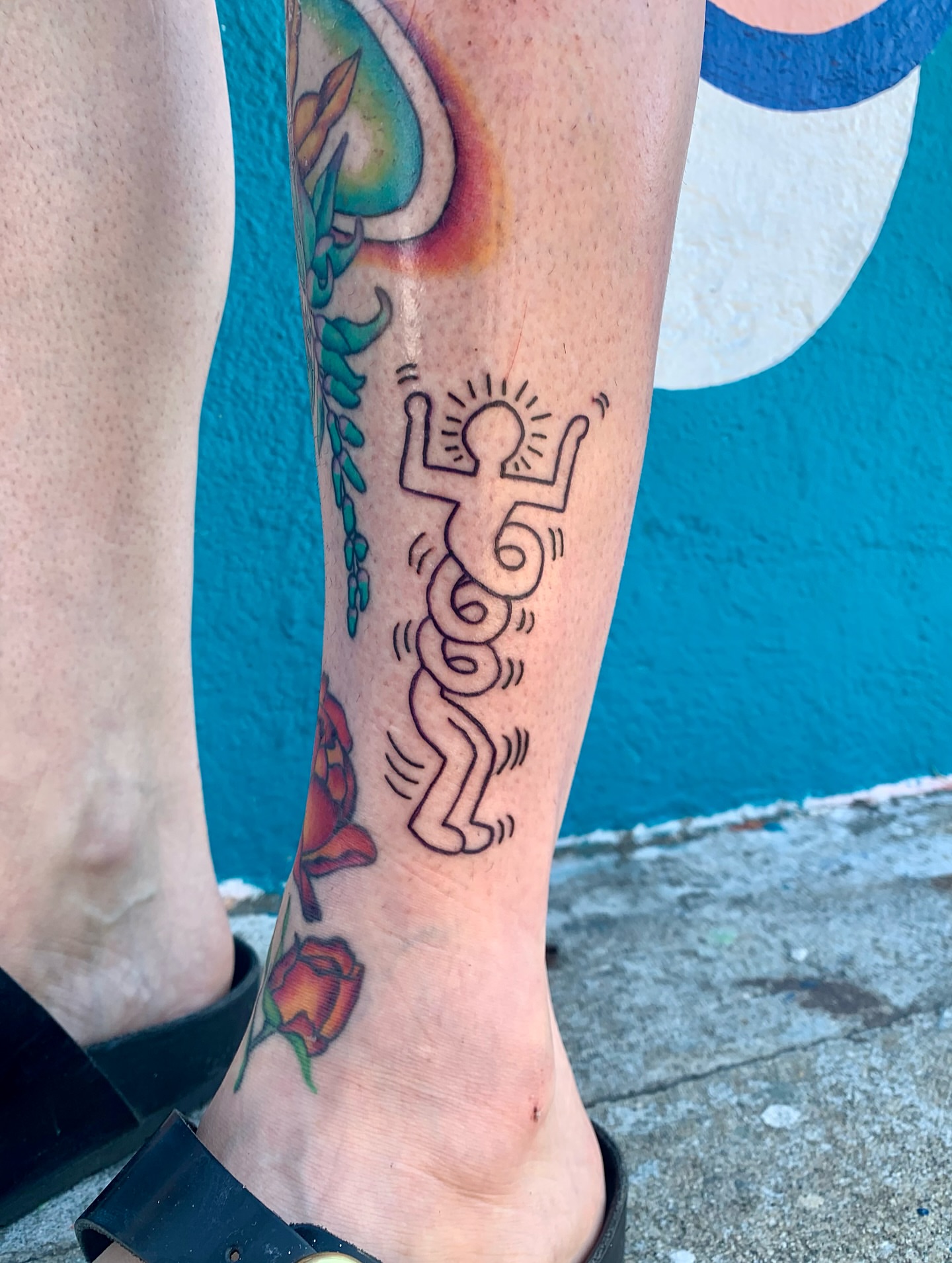 Keith haring-inspired figure Chicano tattoo on the calf by CharlieBoy