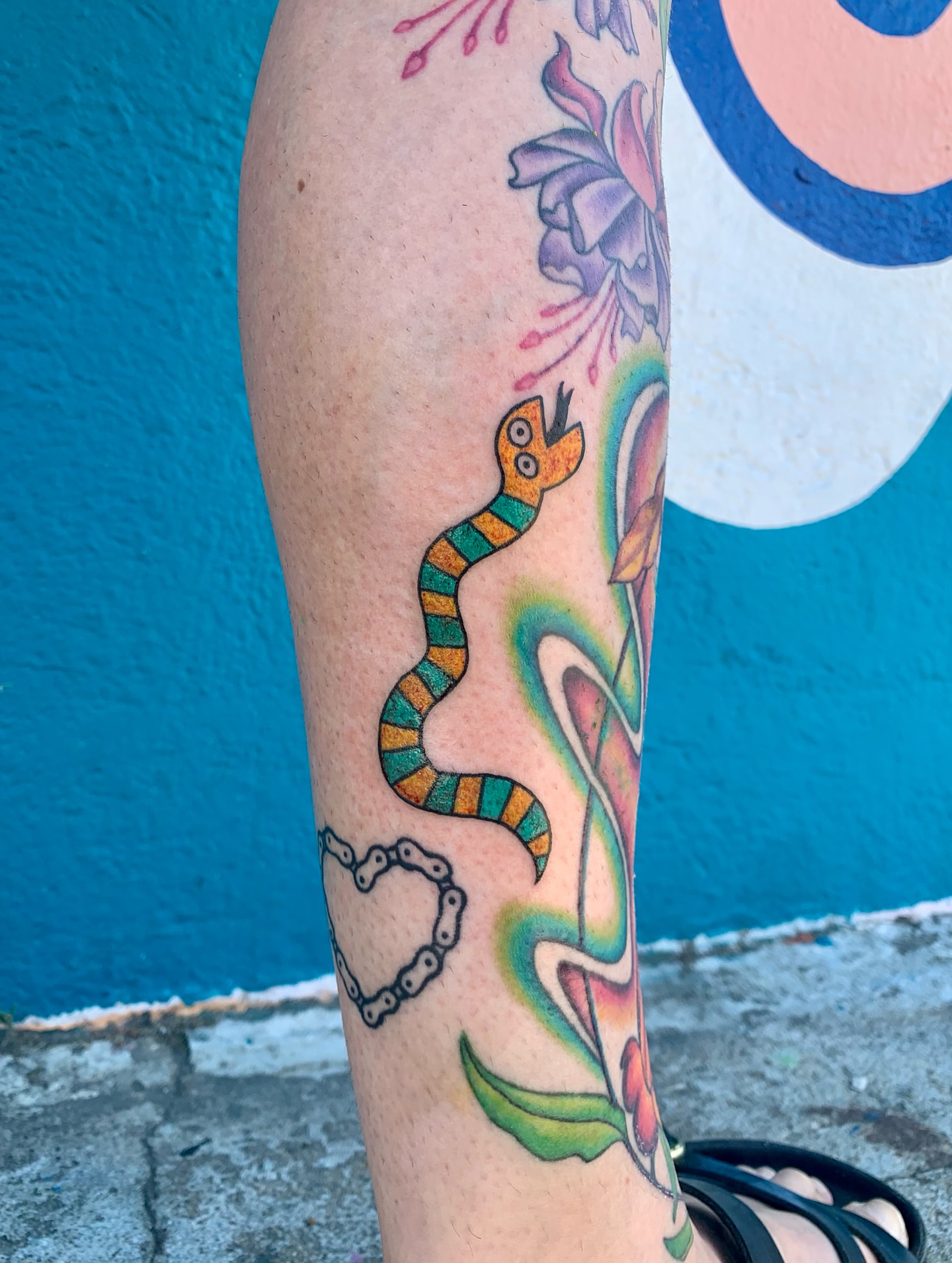 Snake and peony new school tattoo on the forearm by CharlieBoy