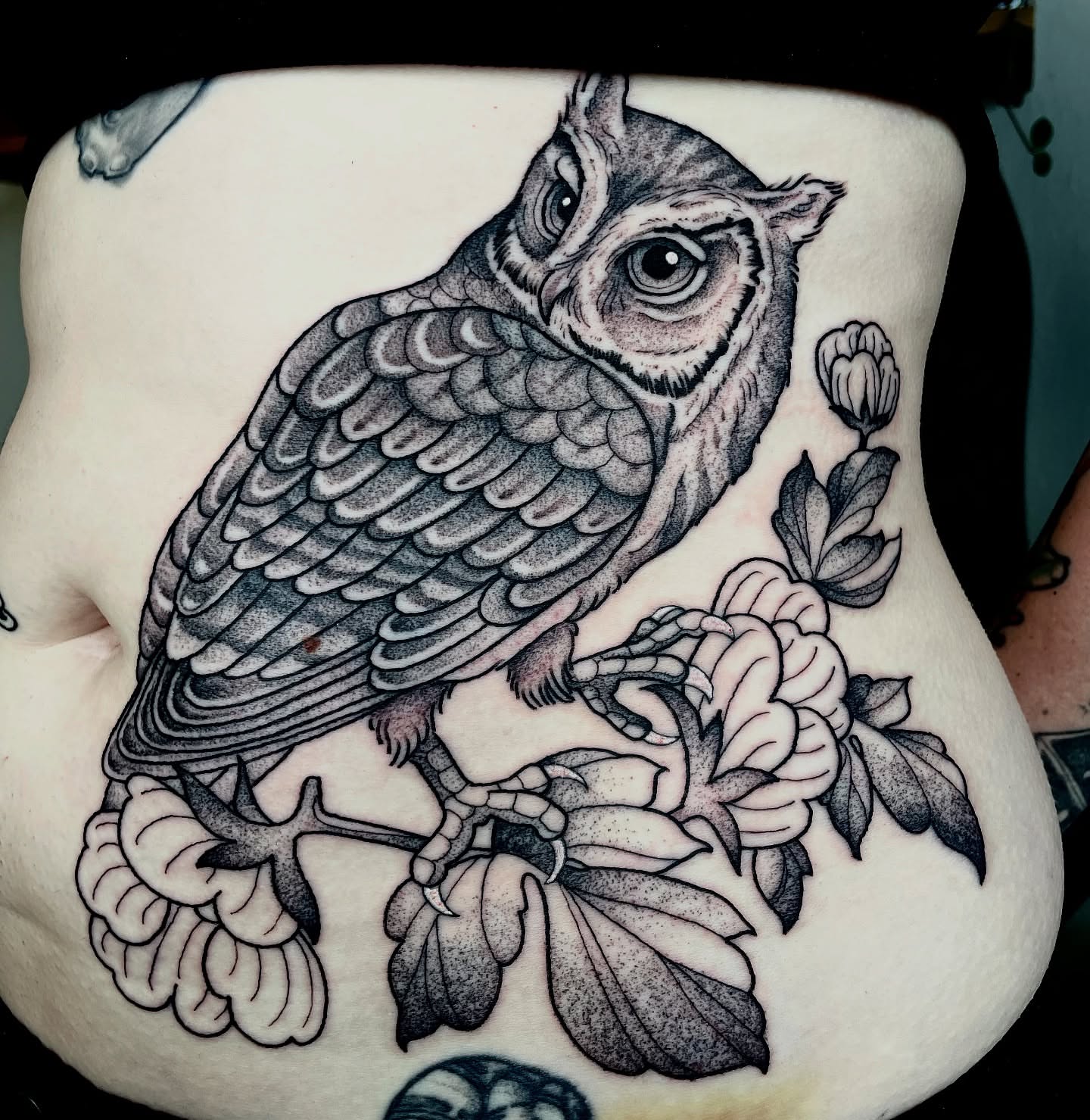 Owl and flowers realism tattoo on the thigh by Emily Lux