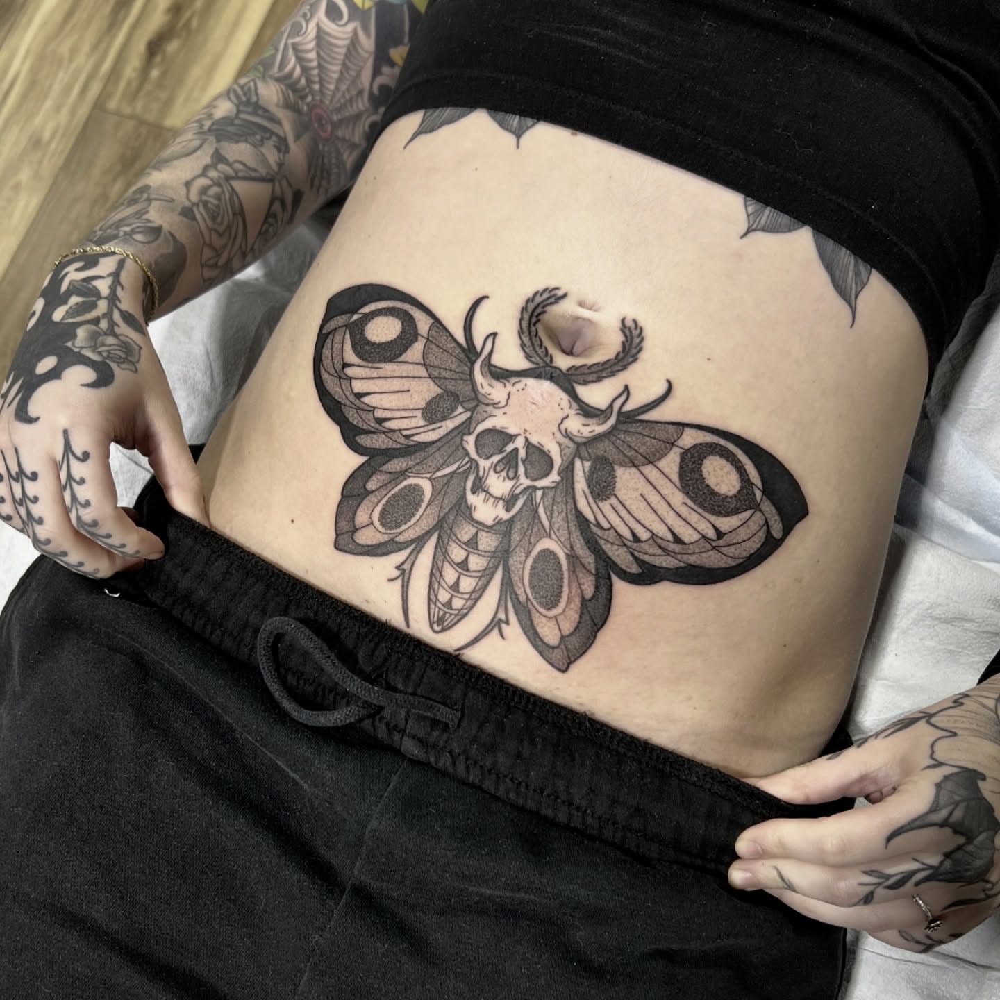 Moth skull black and grey tattoo on the torso by Kendall Orlando