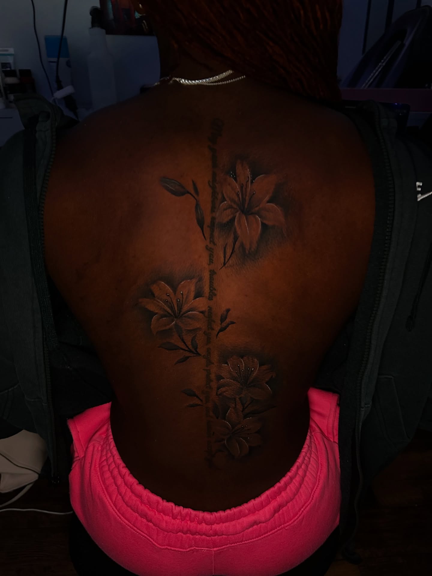 Lily flowers realism tattoo on the back by Chris (Pikasso)