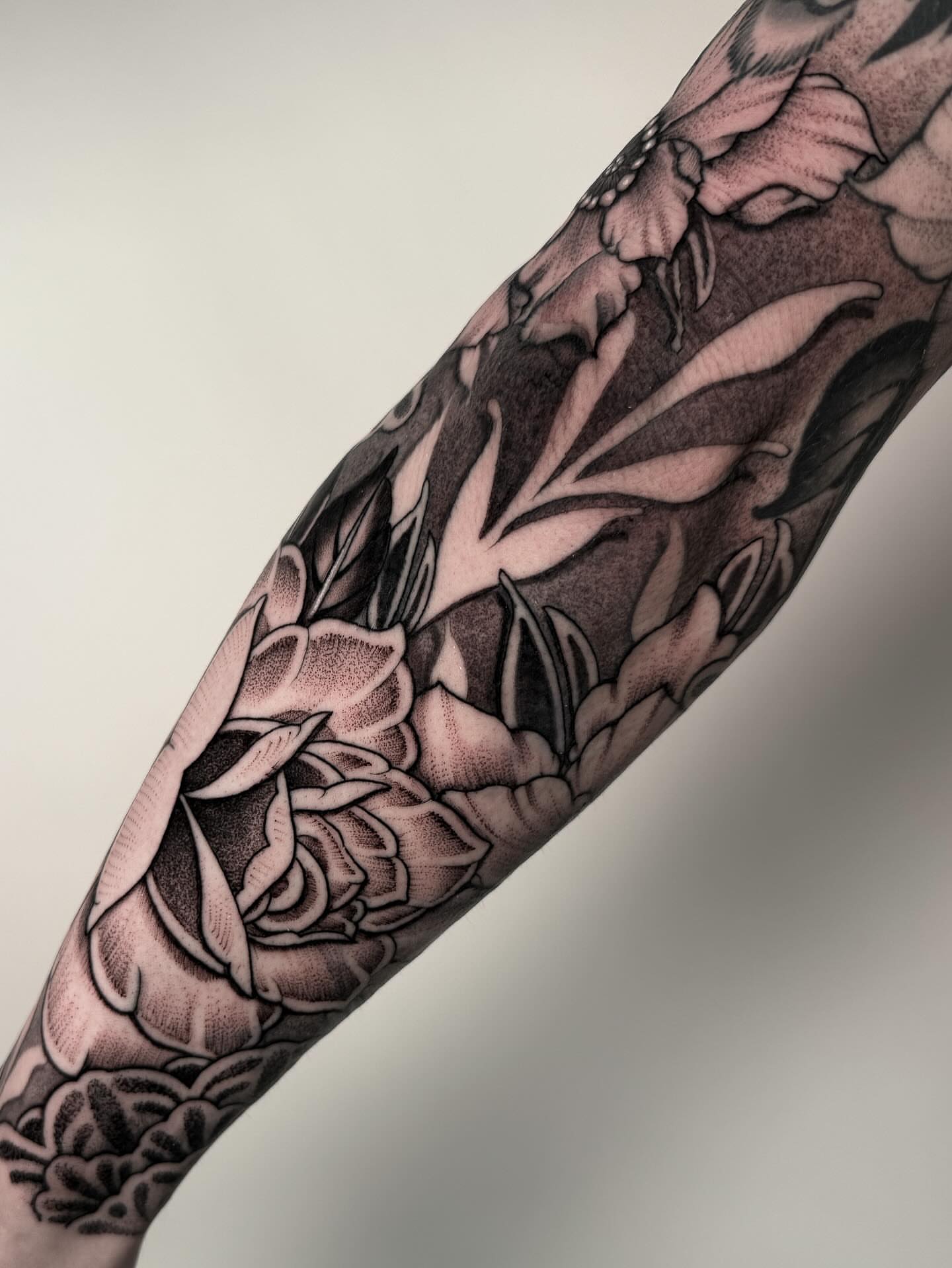 Roses black and grey tattoo on the forearm by Jamie Beach, Wheat Ridge, Colorado
