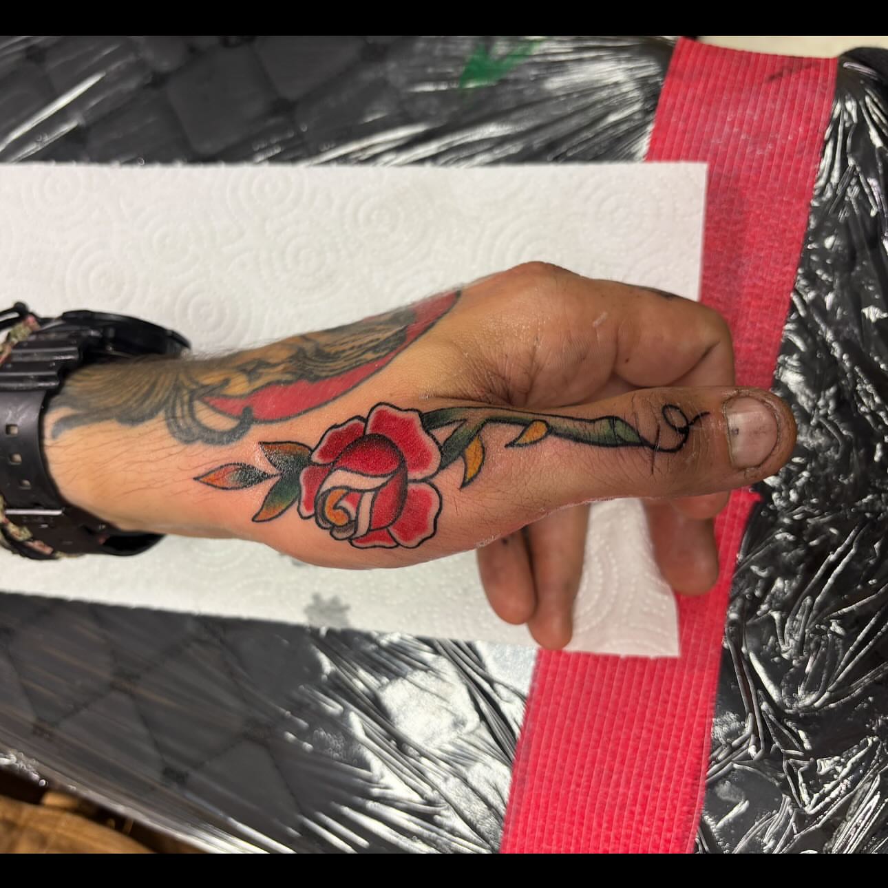 Rose American traditional tattoo on the forearm by Natalie Opal🪻🍎🫖