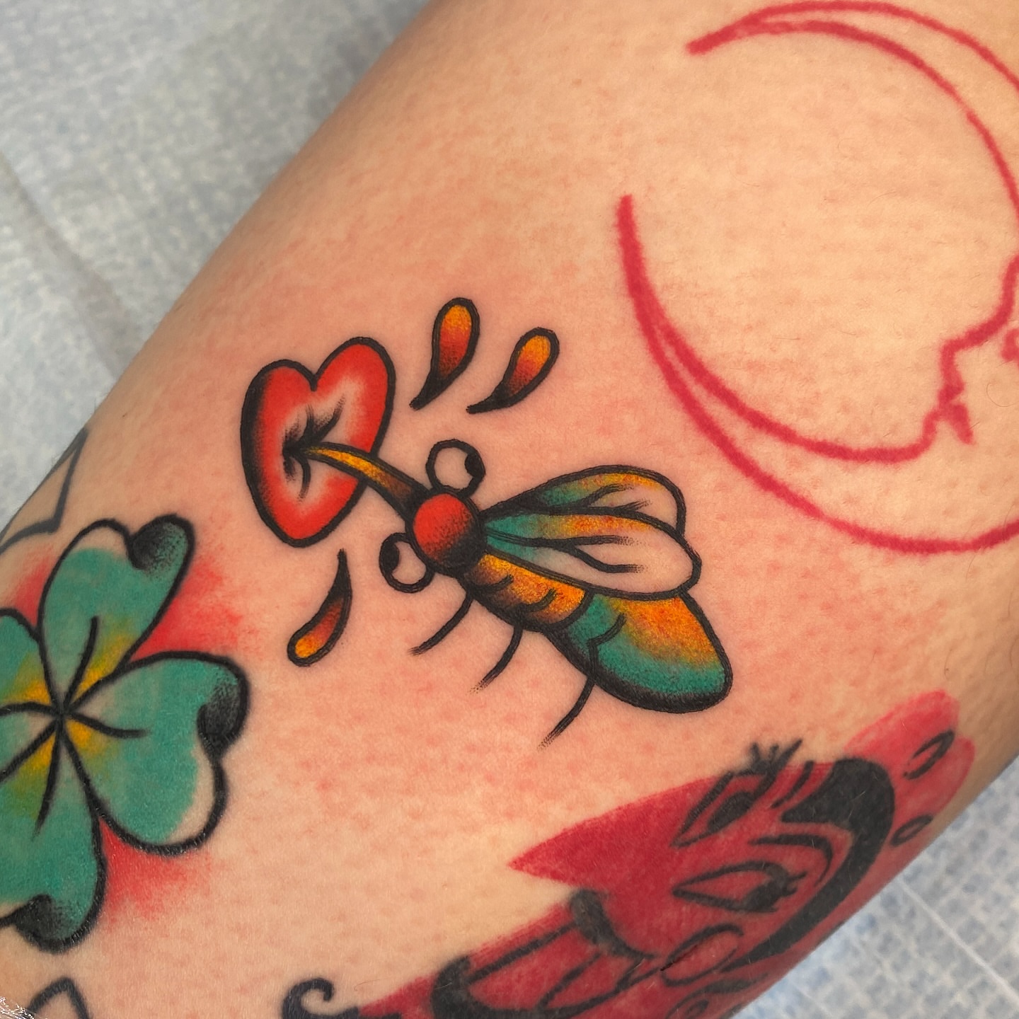 Bee and flower American traditional tattoo on the forearm by Marcos🇩🇴