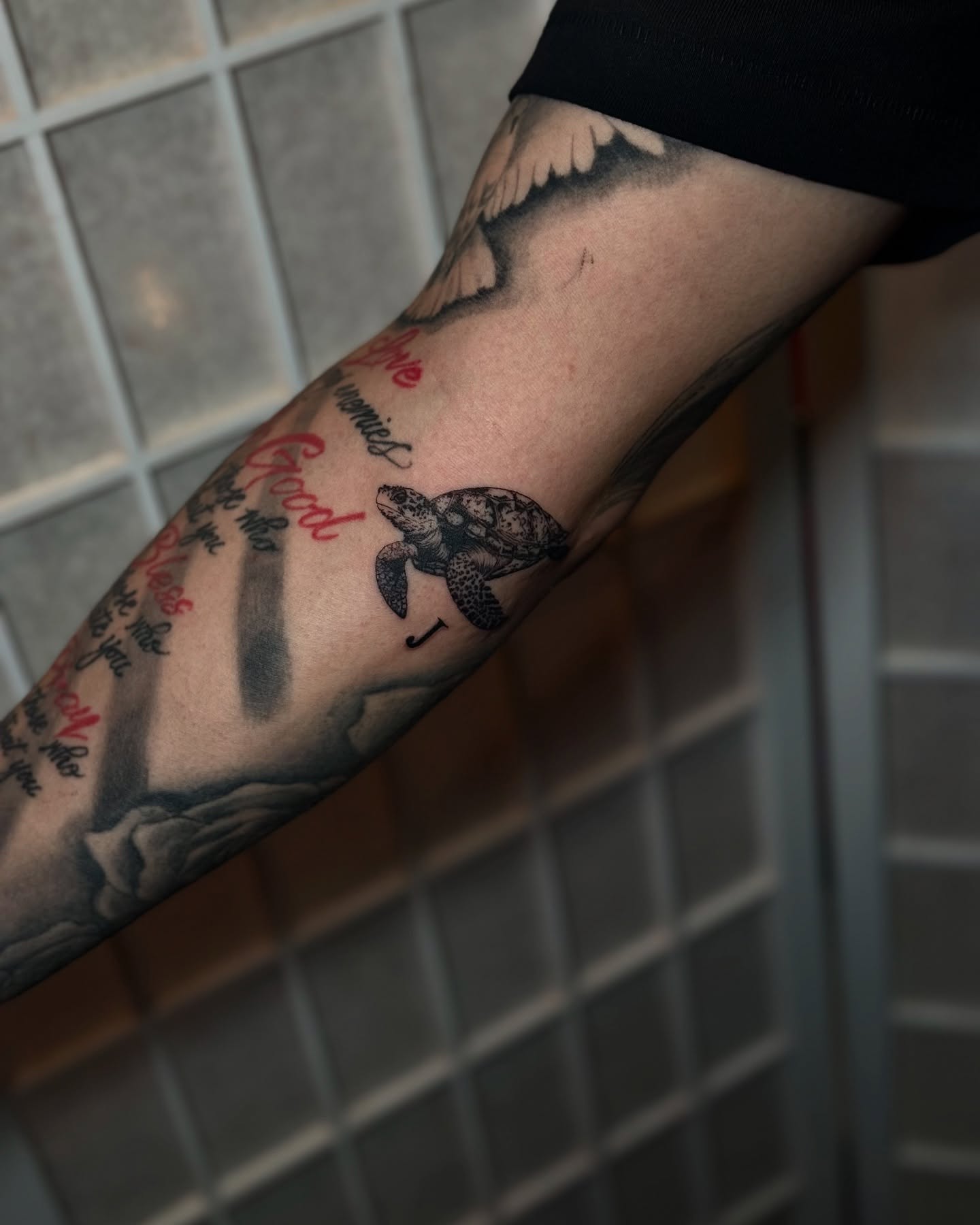 Sea turtle black and grey tattoo on the forearm by Kbtattz