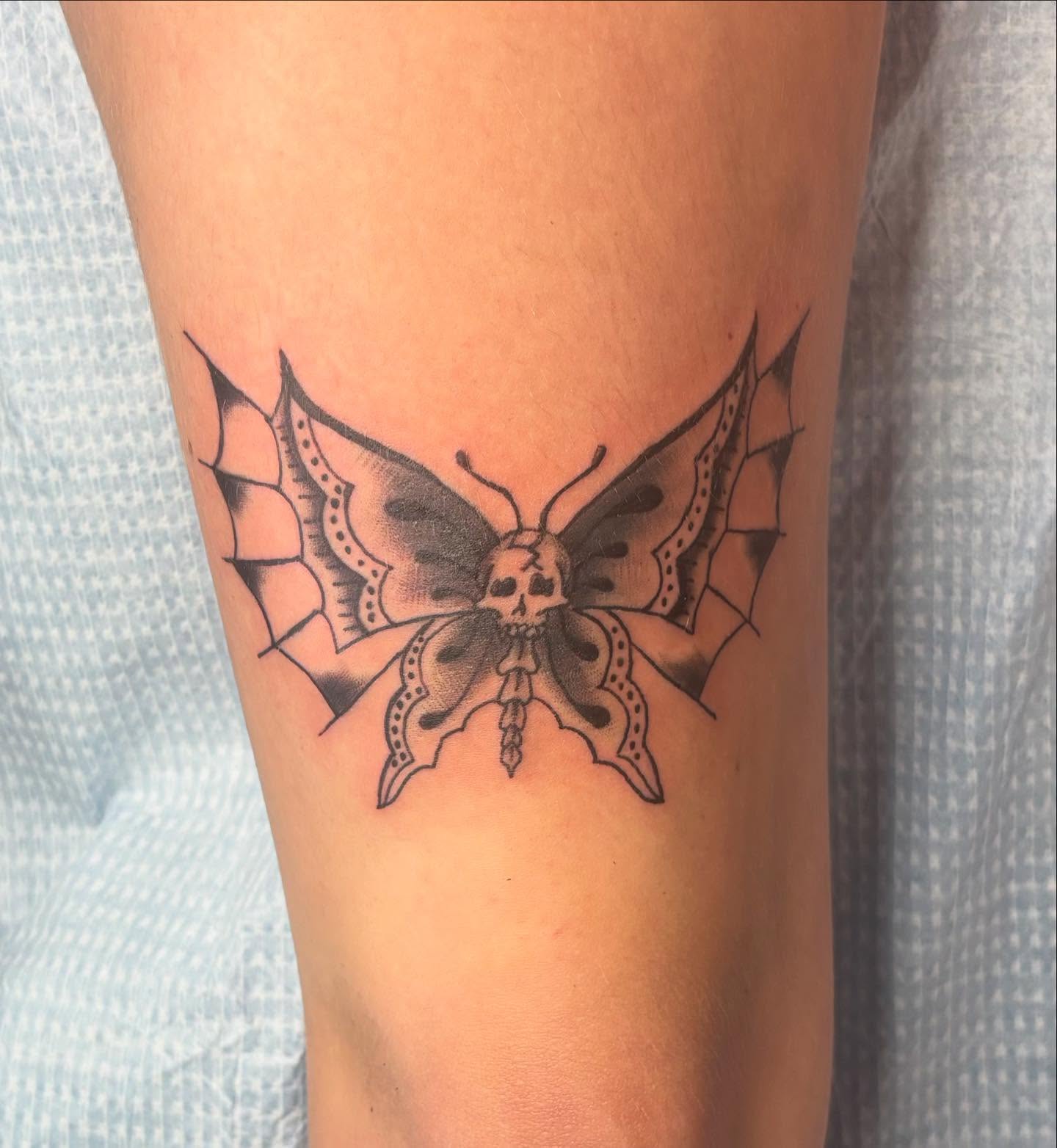 Butterfly black and grey tattoo on the forearm by savannah
